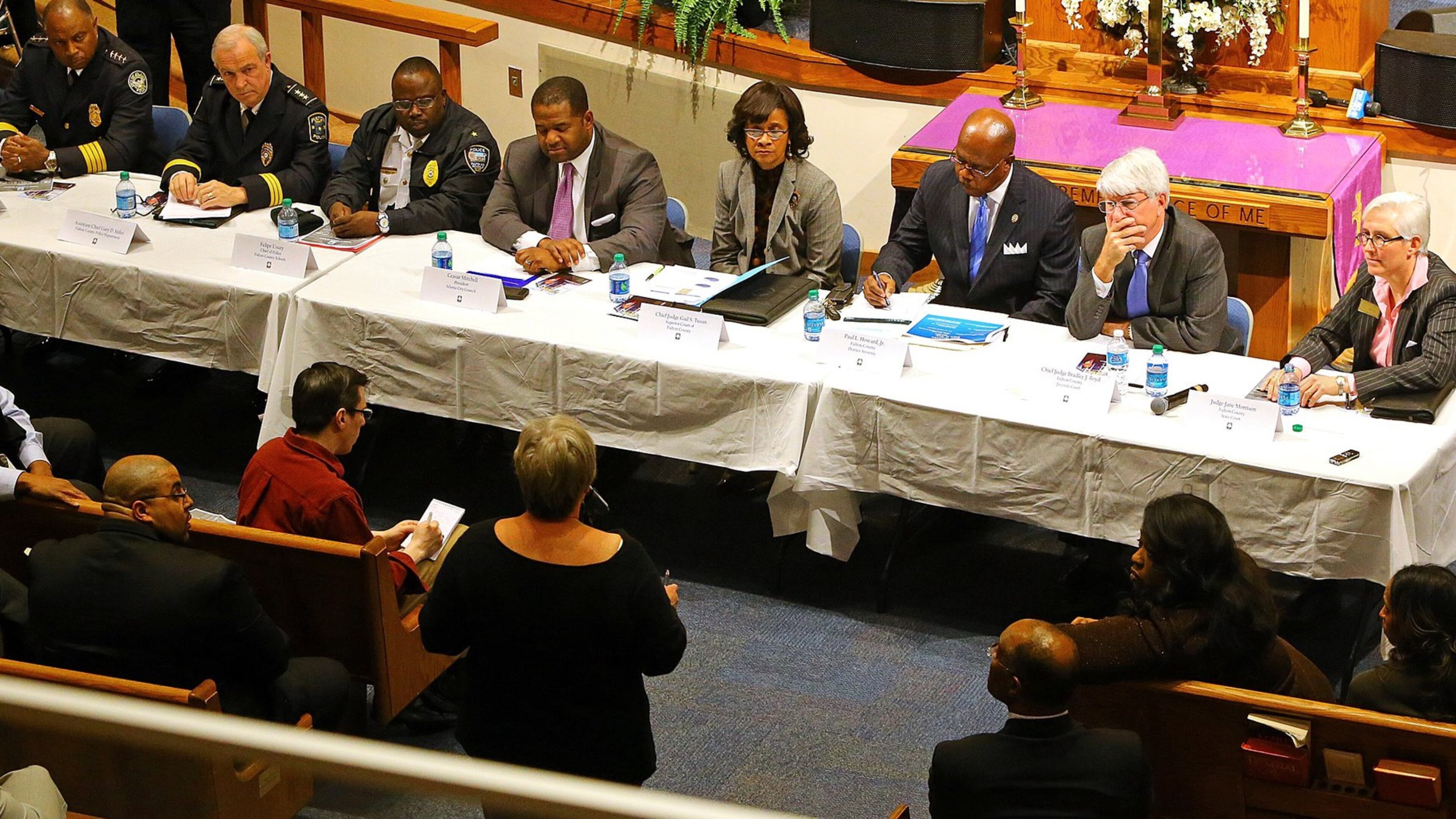 Fulton County Juvenile Court Chief Judge Bradley Boyd (second from right) is pictured with other local judicial and law enforcement officials in 2014 at a Crime & Safety Summit at Cascade United Methodist Church. CURTIS COMPTON / CCOMPTON@AJC.COM