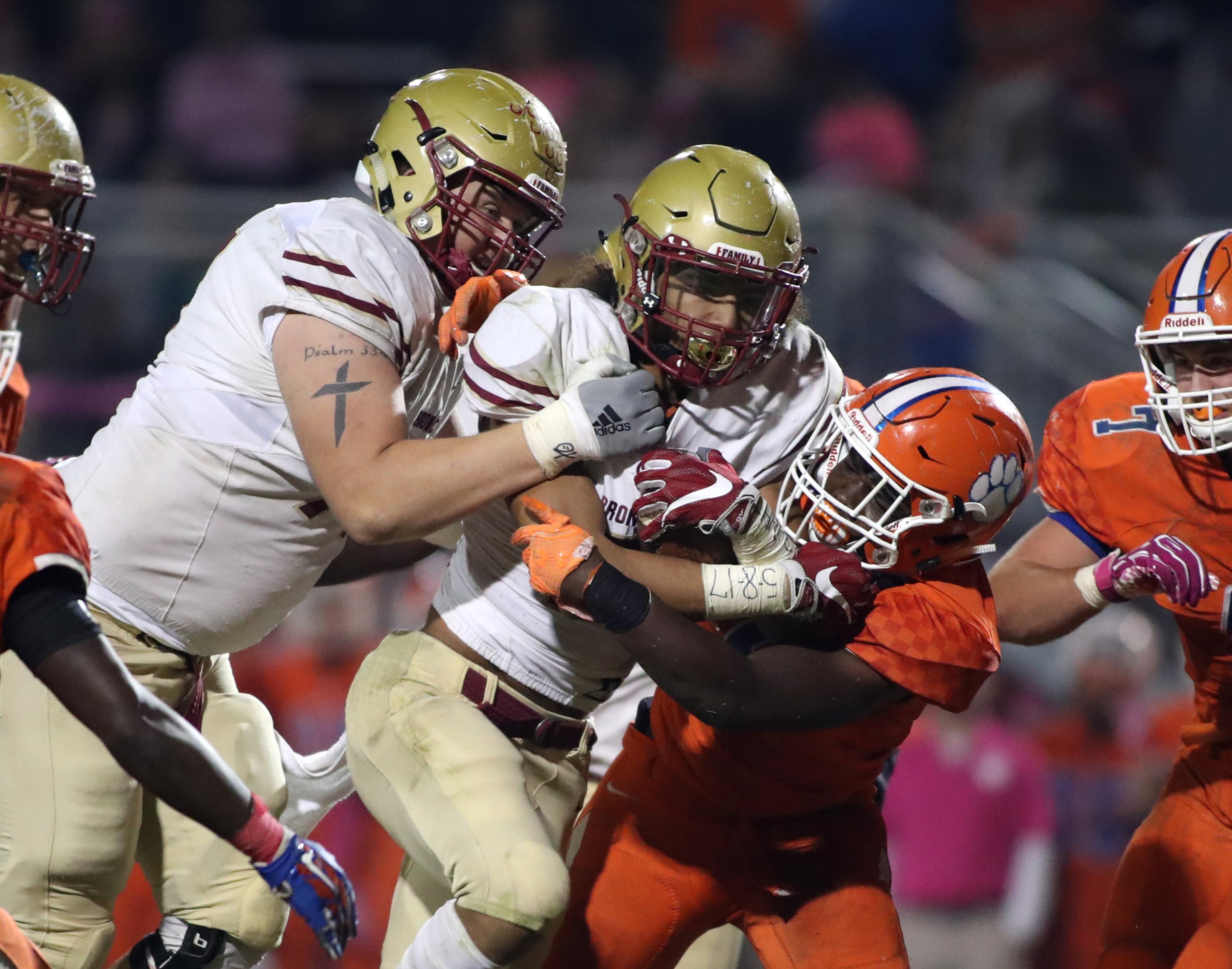 October 20, 2017 - Lilburn, Ga: Brookwood wide receiver Matthew Hill (2) gets a push from offensive lineman Casey Holman (77) for extra yards during a run by Hill in the second half of their game against Parkview at Parkview High School Friday, October 20, 2017, in Lilburn, Ga.. Brookwood won 30-27. PHOTO / JASON GETZ