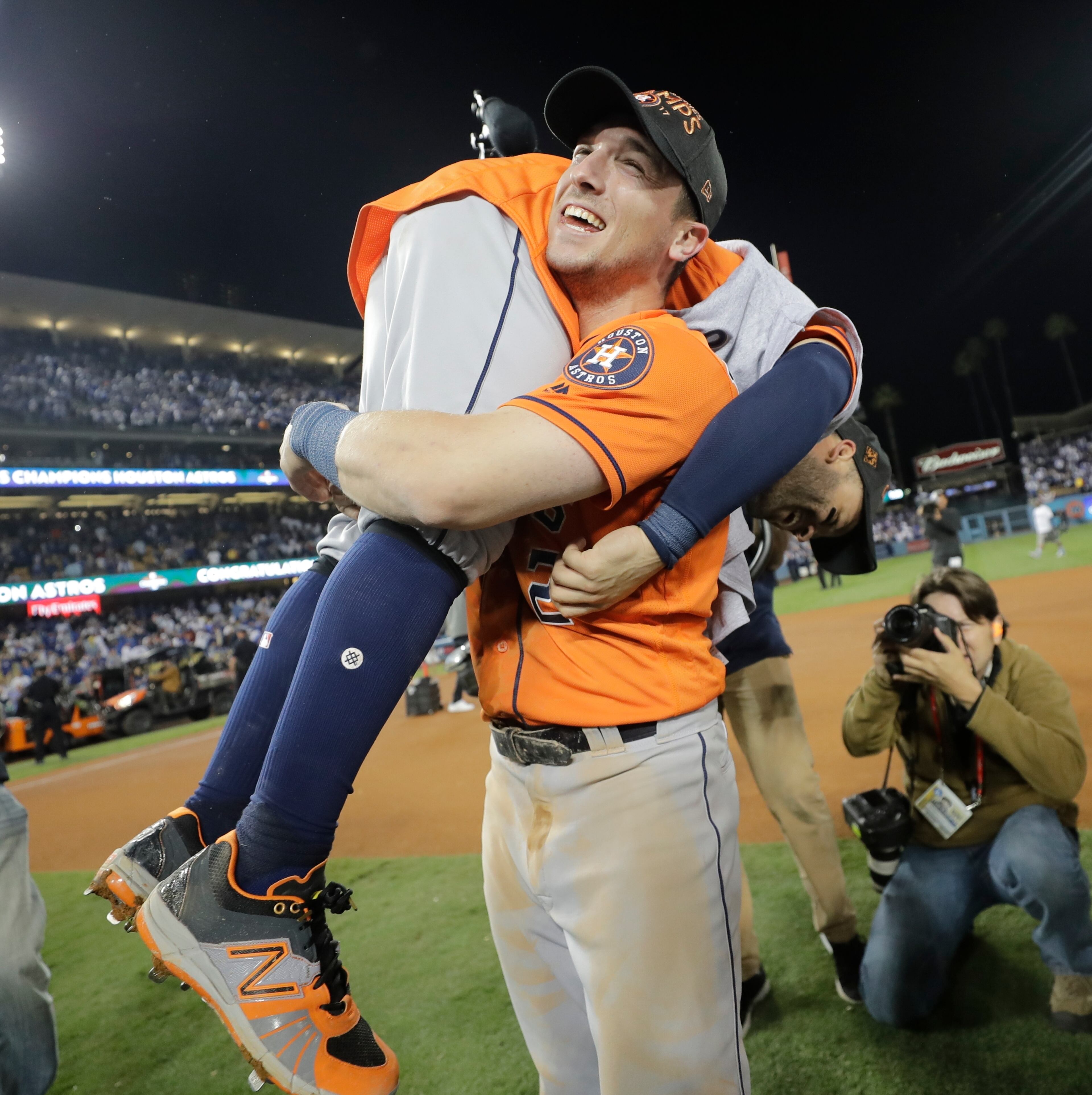 Houston Astros' Jose Altuve and Alex Bregman celebrate after Game 7 of baseball's World Series against the Los Angeles Dodgers Wednesday, Nov. 1, 2017, in Los Angeles. The Astros won 5-1 to win the series 4-3. (AP Photo/David J. Phillip)
