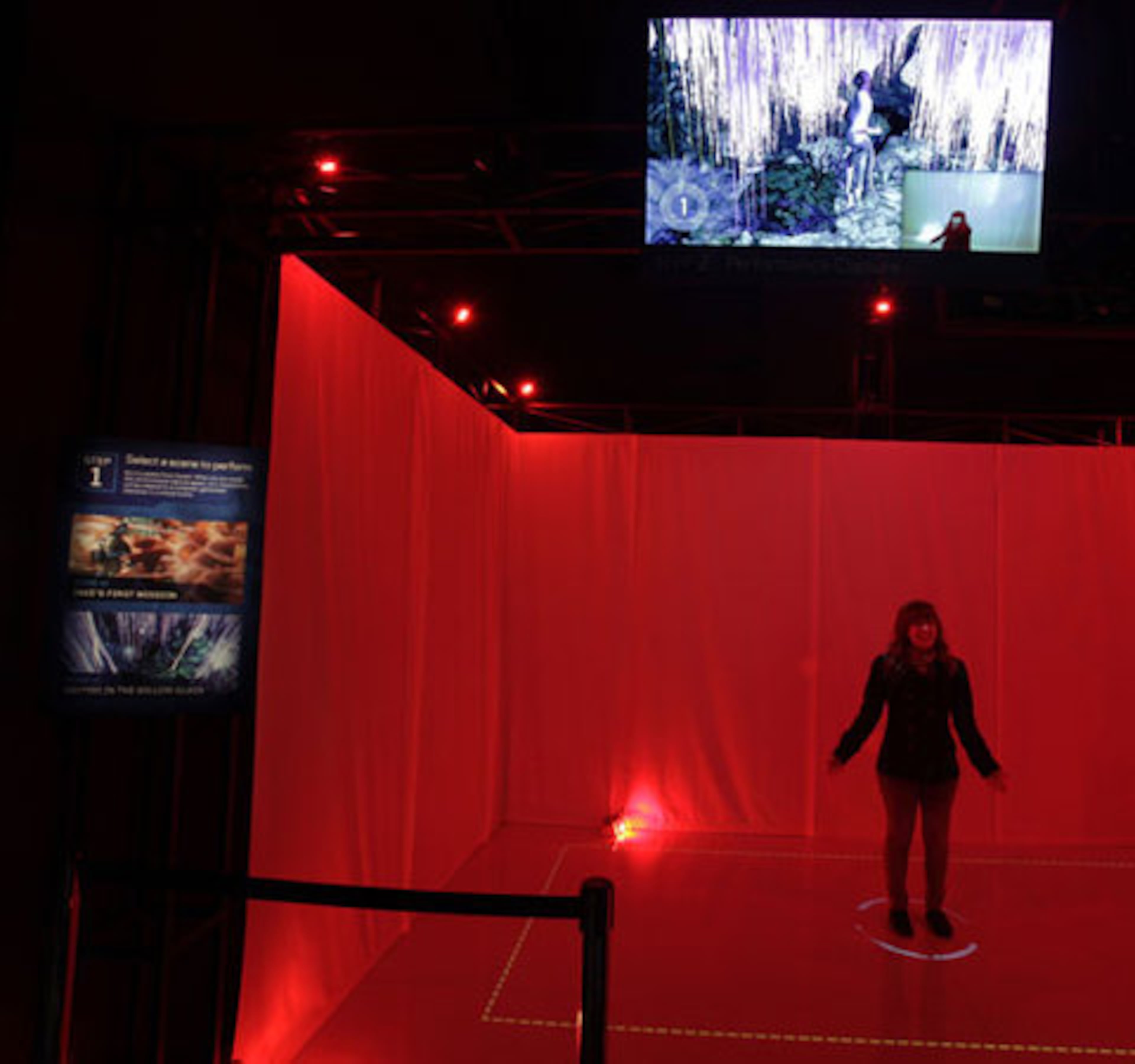 A visitor stands in an exhibit that lets visitors take the place of an actor from the film using motion capture technology.