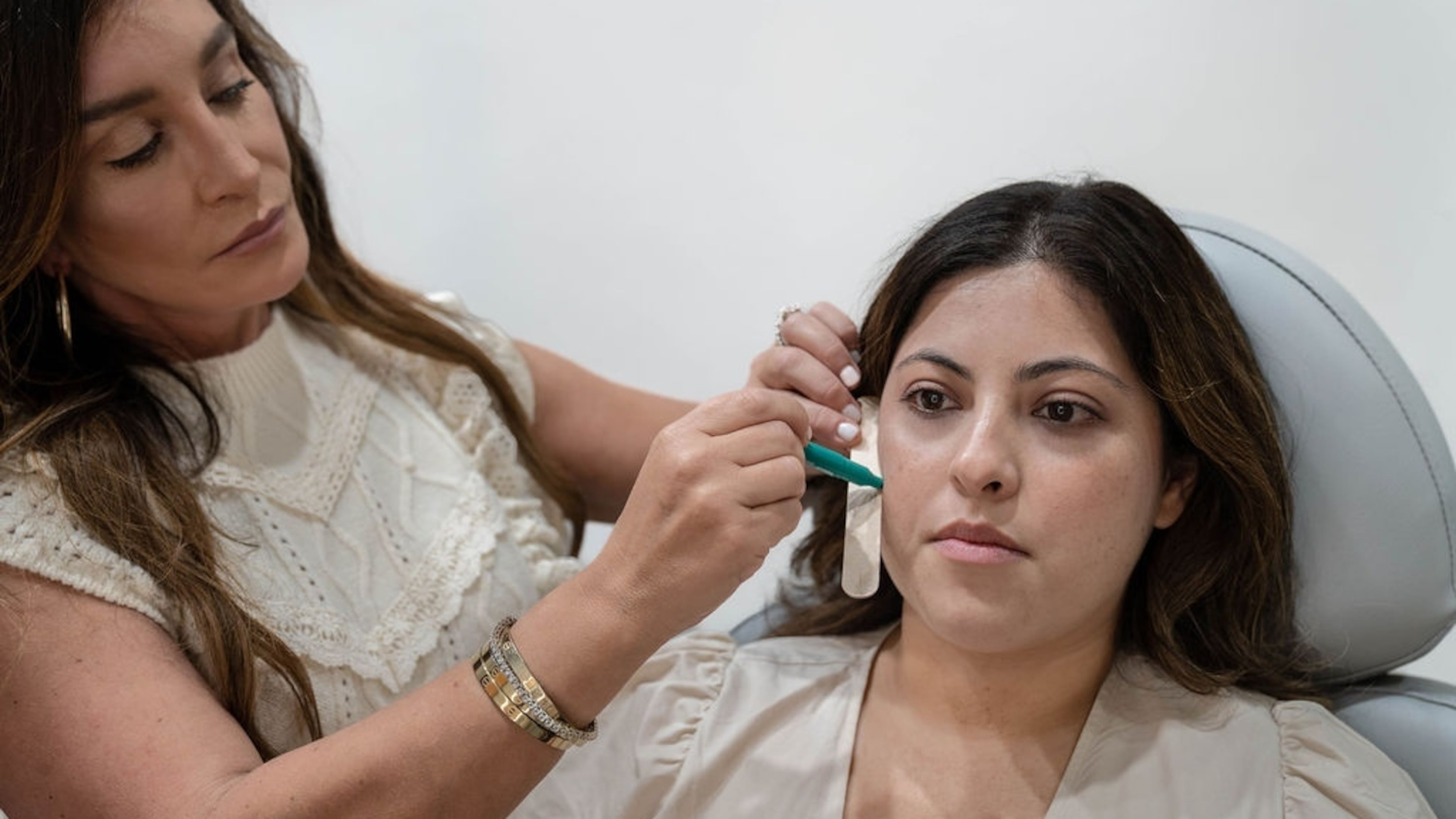 Daniela Ezratty (left), owner of Virginia-Highland-based Ezratty Integrative Aesthetics, meets with a client to discuss facial balancing. (Courtesy of Ezratty Integrative Aesthetics)