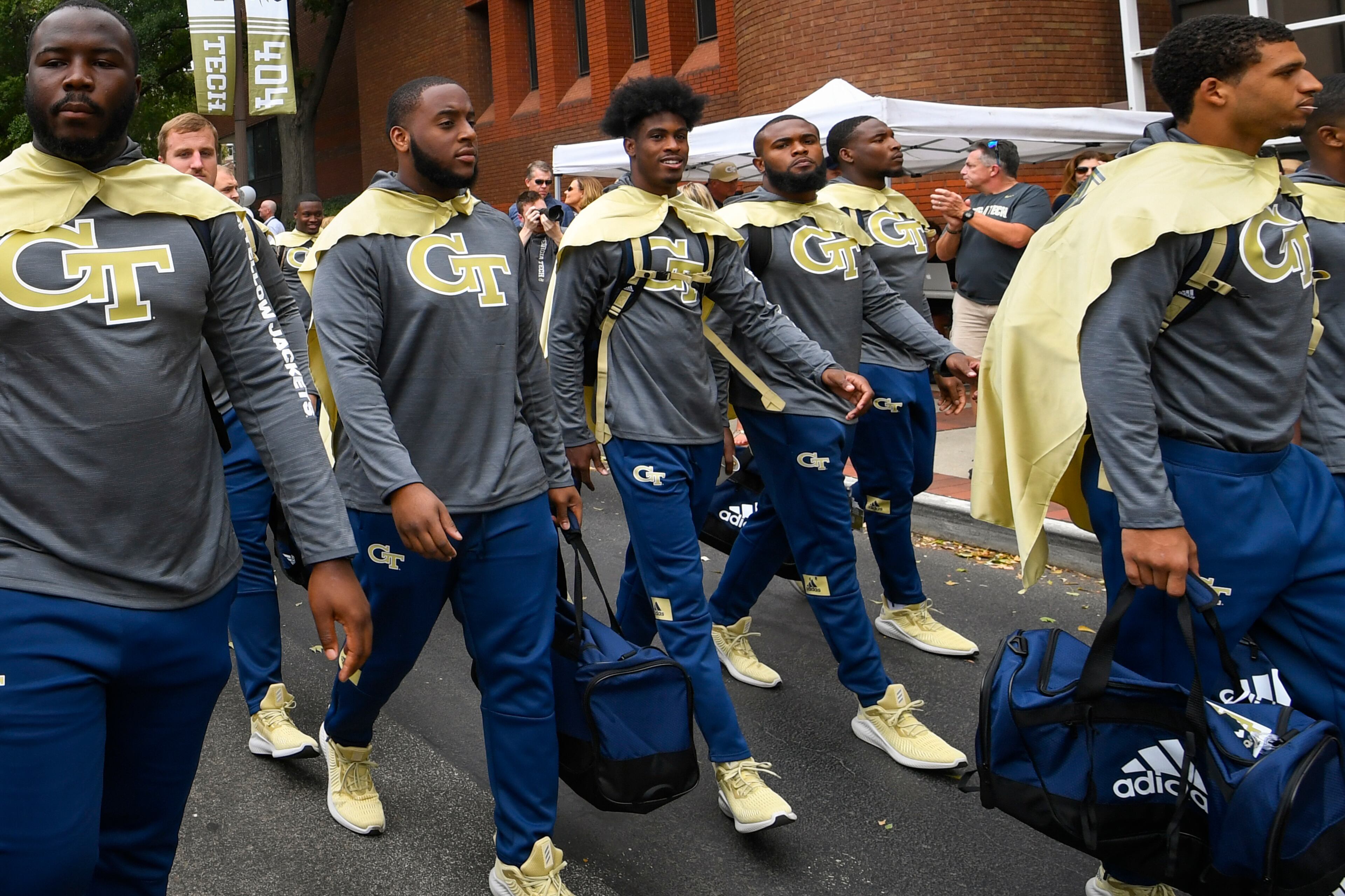 Georgia Tech players walk Yellow Jacket Alley before an NCAA college football game against North Carolina, Saturday, Oct. 5, 2019, in Atlanta. (Special-John Amis)
