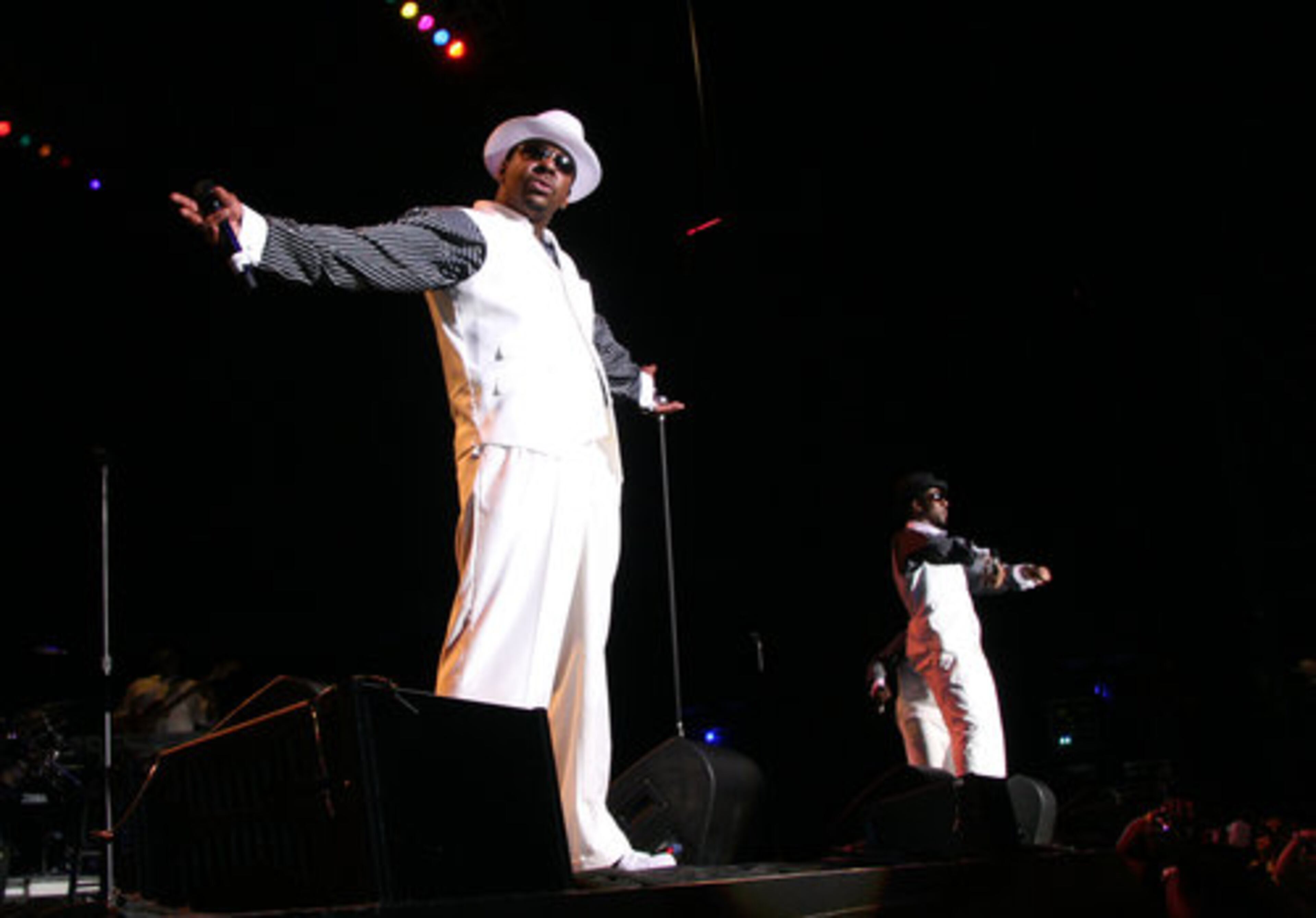 Bobby Brown takes in the audience's applause alongside Heads of State member Ralph Tresvant (right).