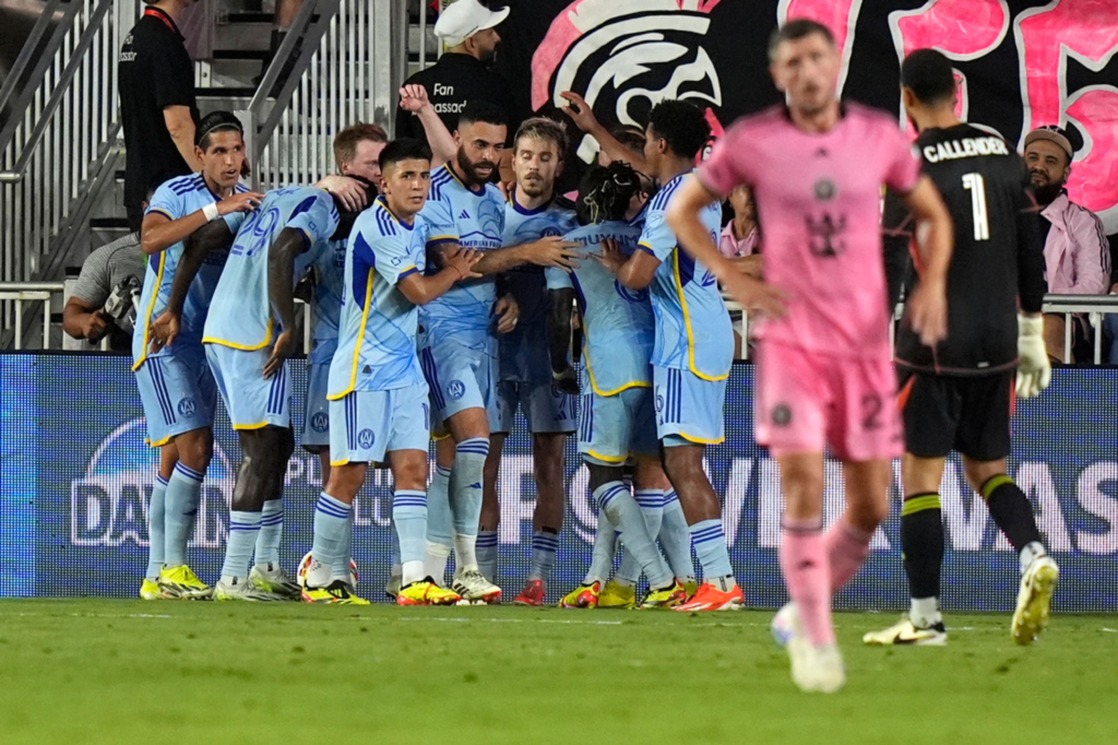 Atlanta United players celebrate after midfielder Saba Lobzhanidze, center, scored a goal against Inter Miami during the first half of an MLS soccer match Wednesday, May 29, 2024, in Fort Lauderdale, Fla. Atlanta United won 3-1. (AP Photo/Lynne Sladky)