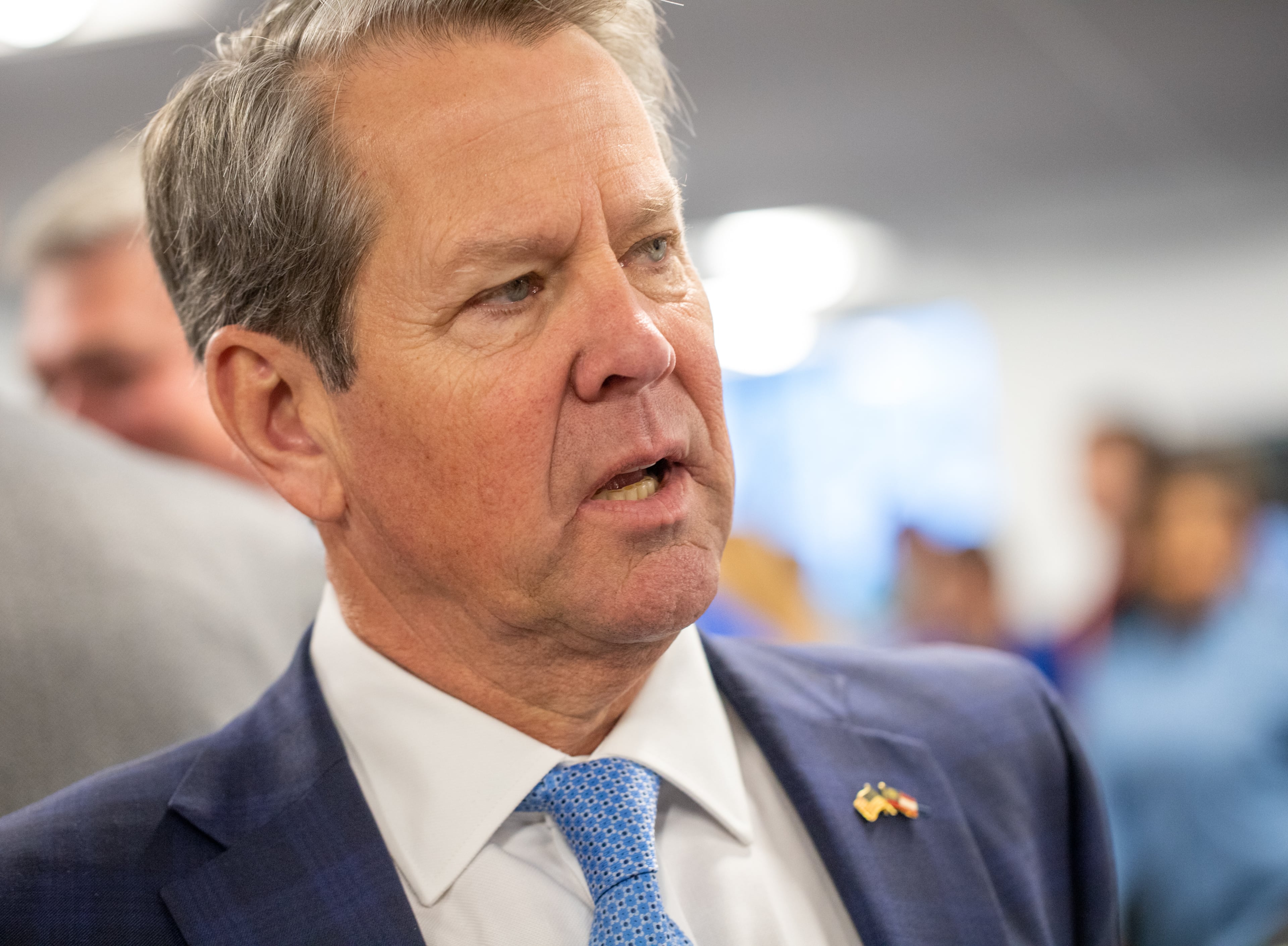 Gov. Brian Kemp warned attendees at a GOP barbecue in Monroe to remain engaged next year or risk Georgia turning into an eternal battleground. (Jenni Girtman for The Atlanta Journal-Constitution)