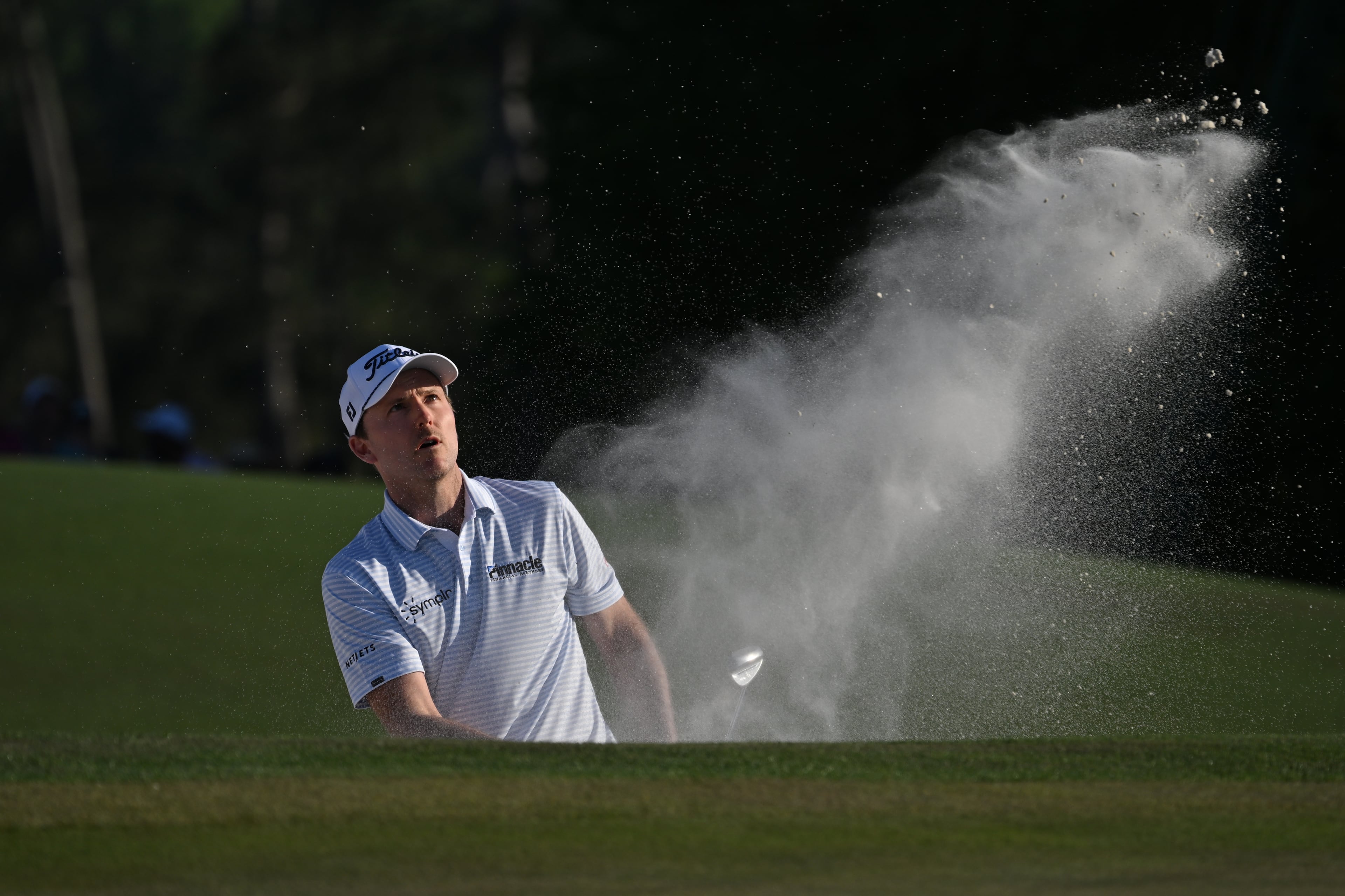 Russell Henley hits out of bunker on the 18th hole during second round of the Masters at Augusta National on Friday, April 10, 2026, in Augusta, Ga. (Hyosub Shin/AJC)