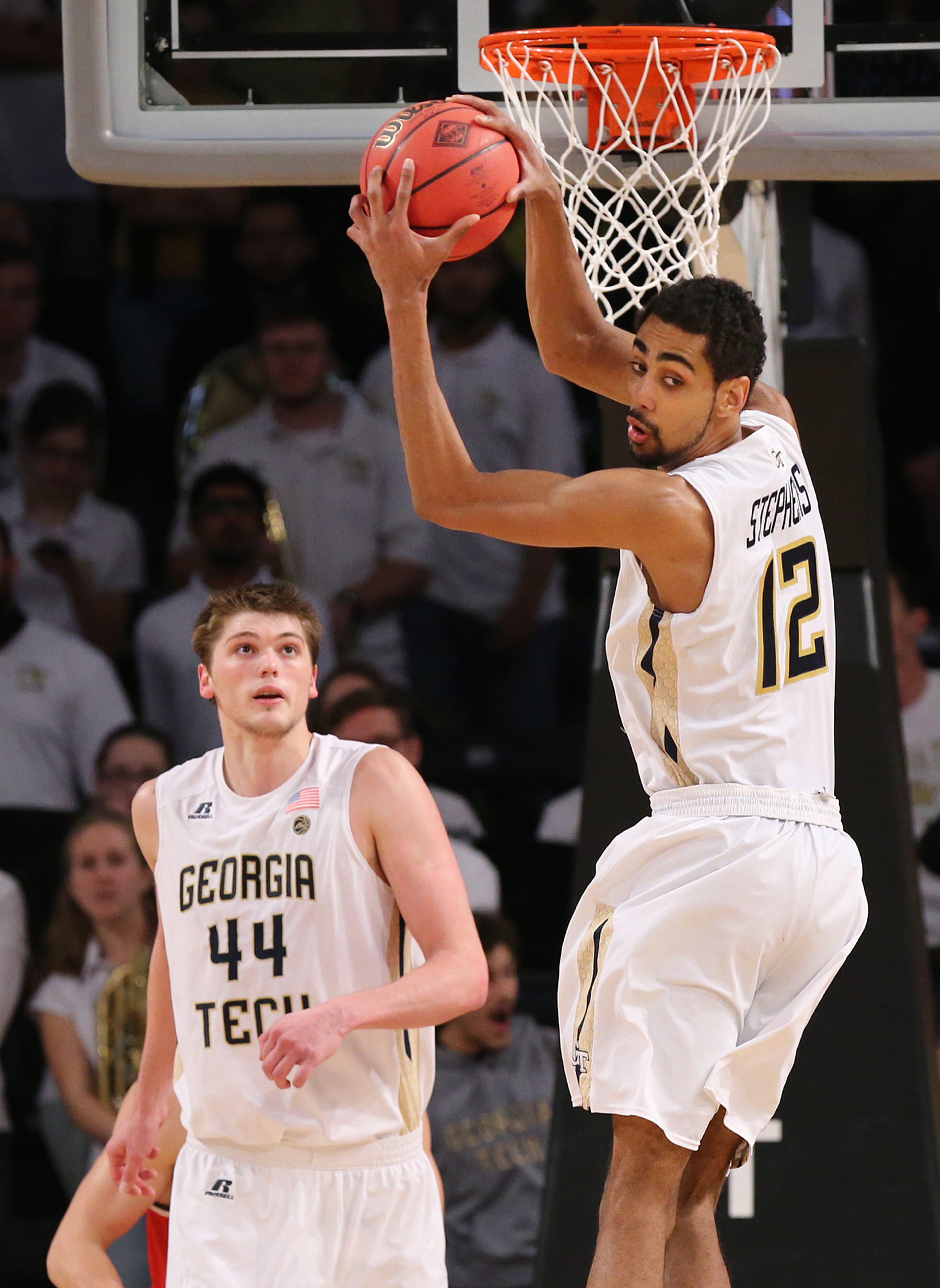 Quinton Stephens grabs a defensive rebound against Belmont with center Ben Lammers looking on.