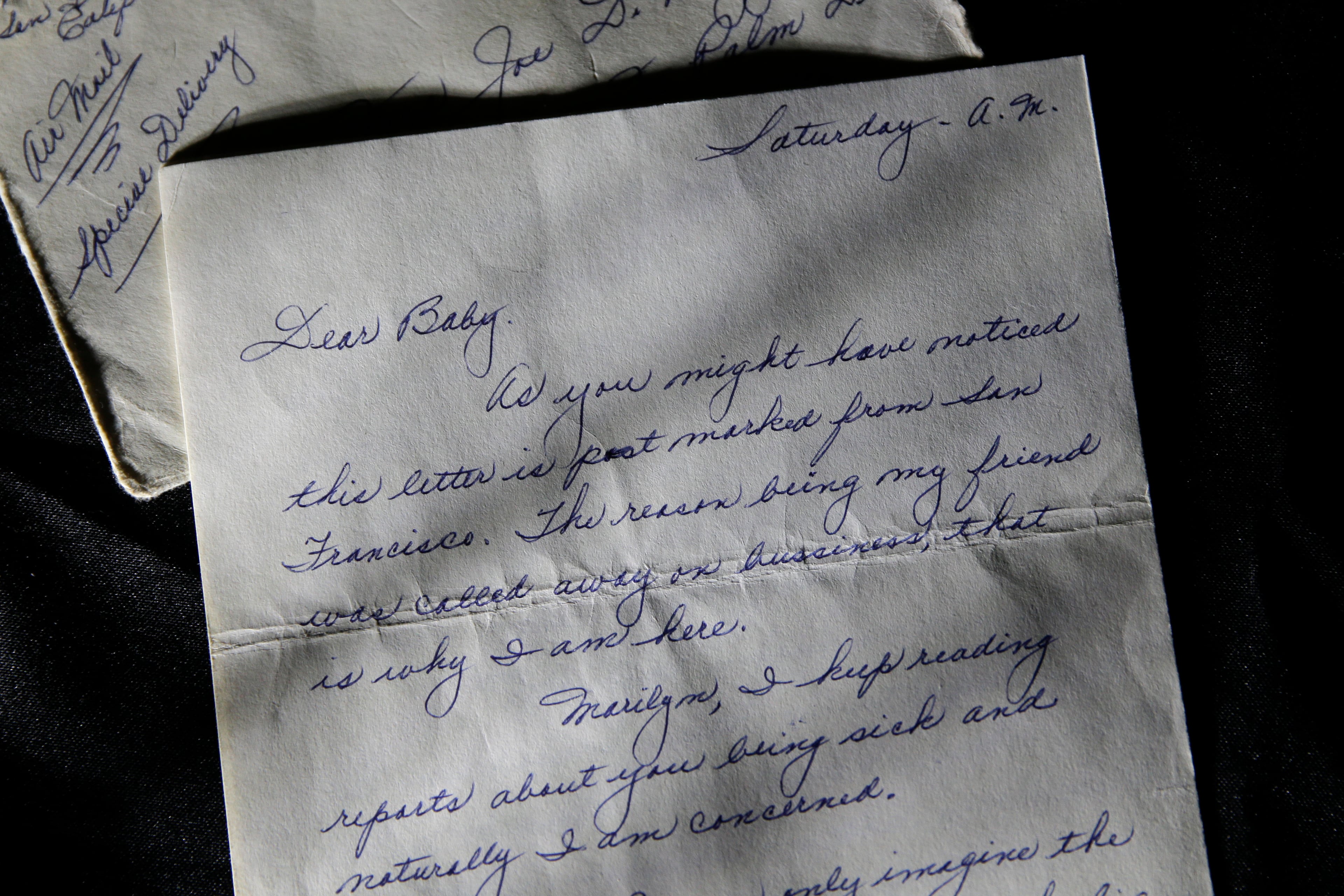 This Nov. 7, 2014 photo shows part of a three-page handwritten letter and original envelope postmarked Oct. 9, 1954 from baseball legend Joe DiMaggio to Marilyn Monroe. The letter is among the 300 items that are part of "Marilyn Monroe's Lost Archives" that go up for bid at Julien's Auctions in Beverly Hills on Dec. 5-6, 2014. (AP Photo/Jae C. Hong)