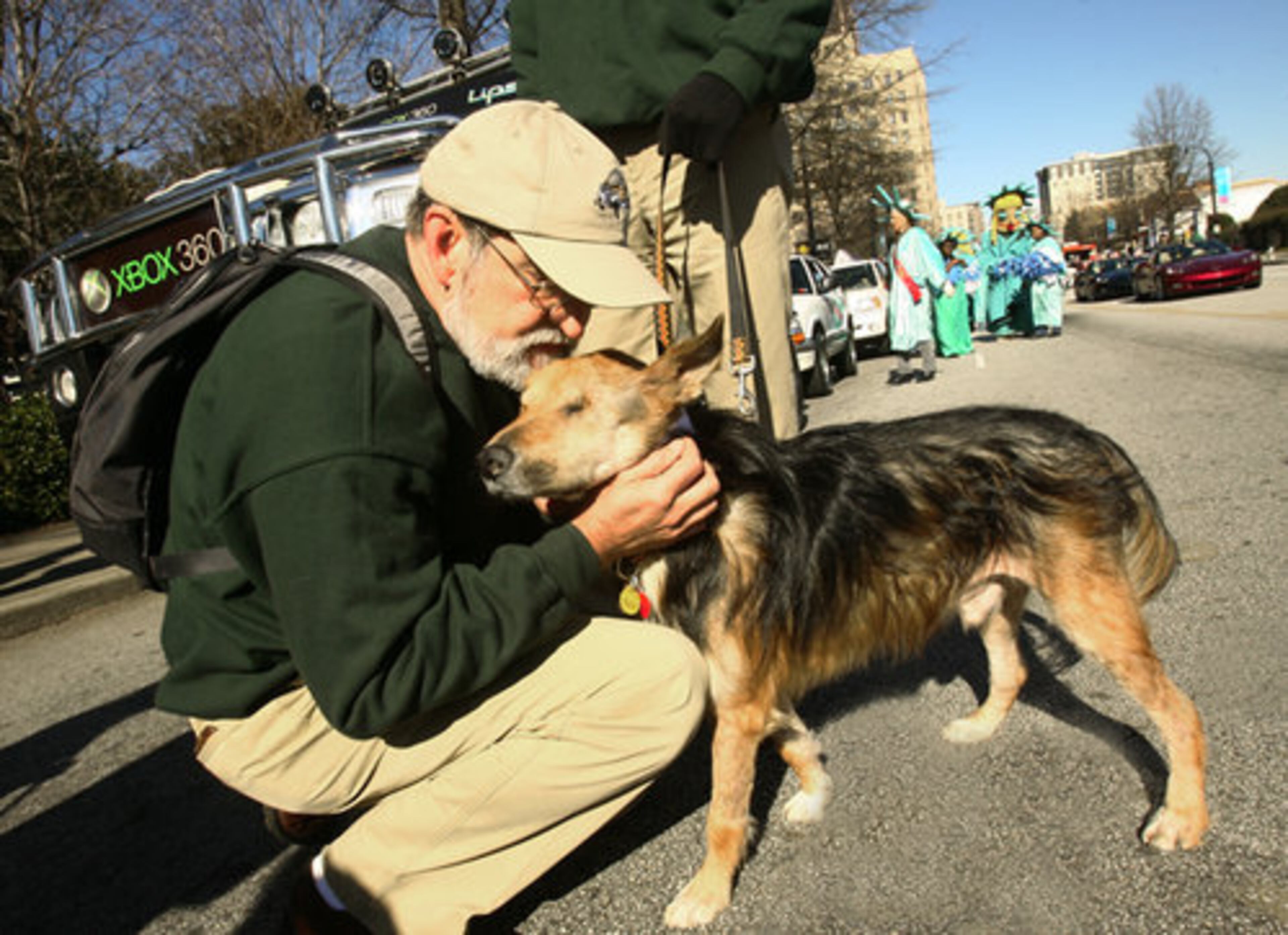Robert Kennedy gives his dog Murphy a snuggle before the parade.