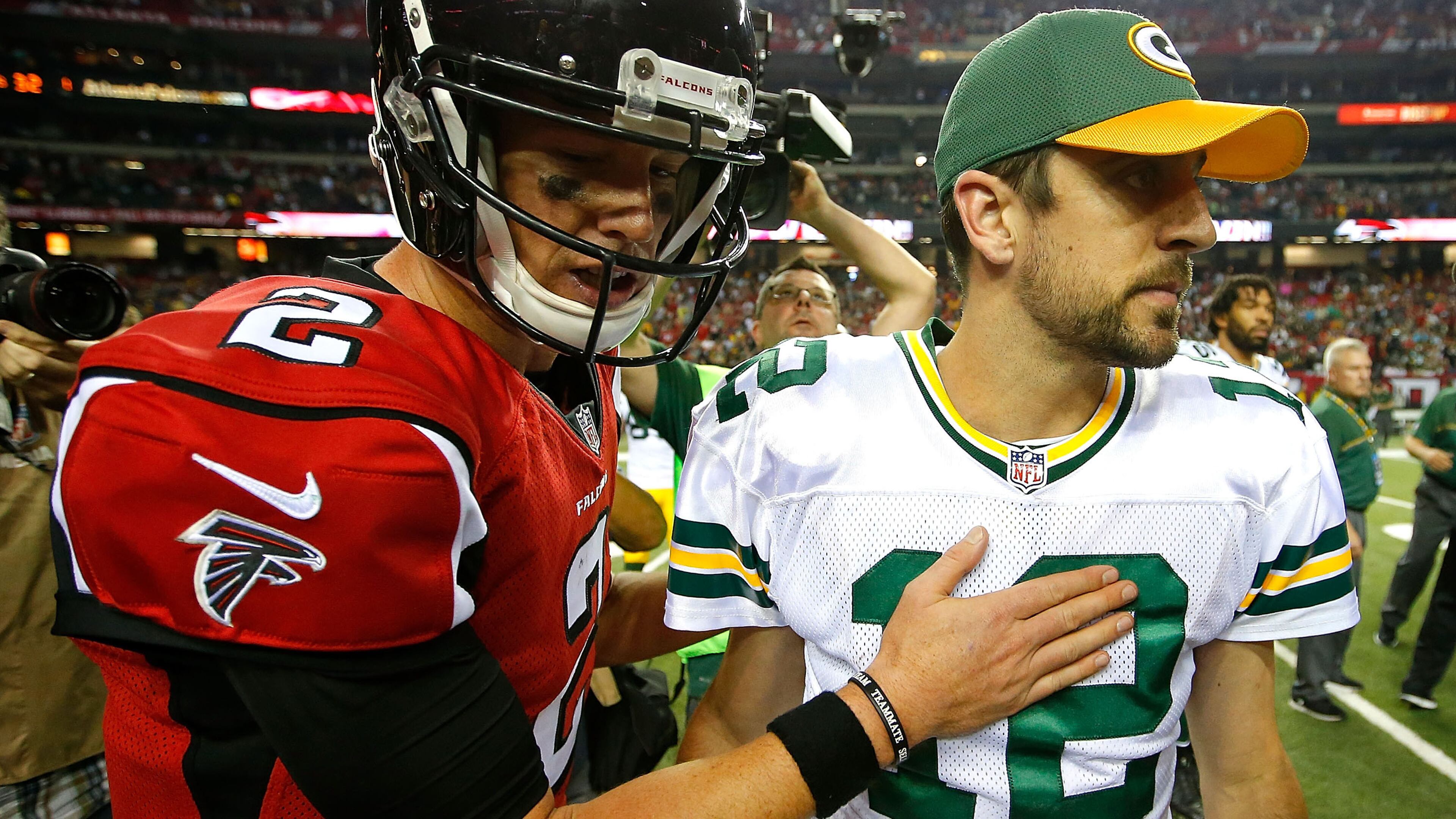 Falcons quarterback Matt Ryan meets Packers quarterback Aaron Rodgers at midfield after the Falcons defeated the Packers, 33-32, at the Georgia Dome on Oct. 30, 2016, in Atlanta.