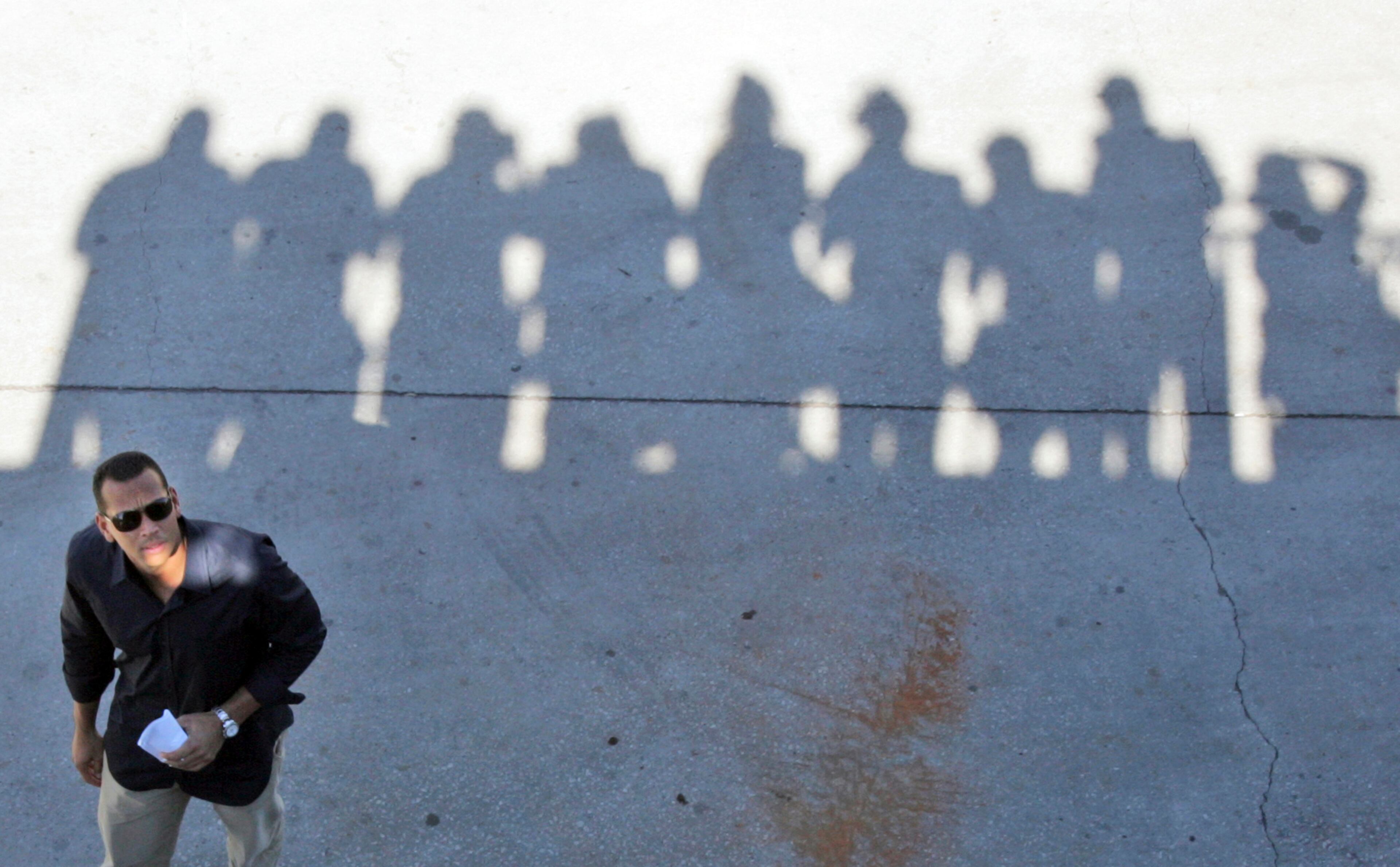2009: New York Yankees baseball player Alex Rodriguez looks up towards photographers after leaving a baseball news conference at George M. Steinbrenner Field in Tampa, Fla. Three MVP awards, 14 All-Star selections, two record-setting contracts and countless controversies later, A-Rod is the biggest and wealthiest target of an investigation into performance-enhancing drugs, with a decision from baseball Commissioner Bud Selig expected on Monday, Aug. 5, 2013. (AP Photo/Mary Altaffer, File)