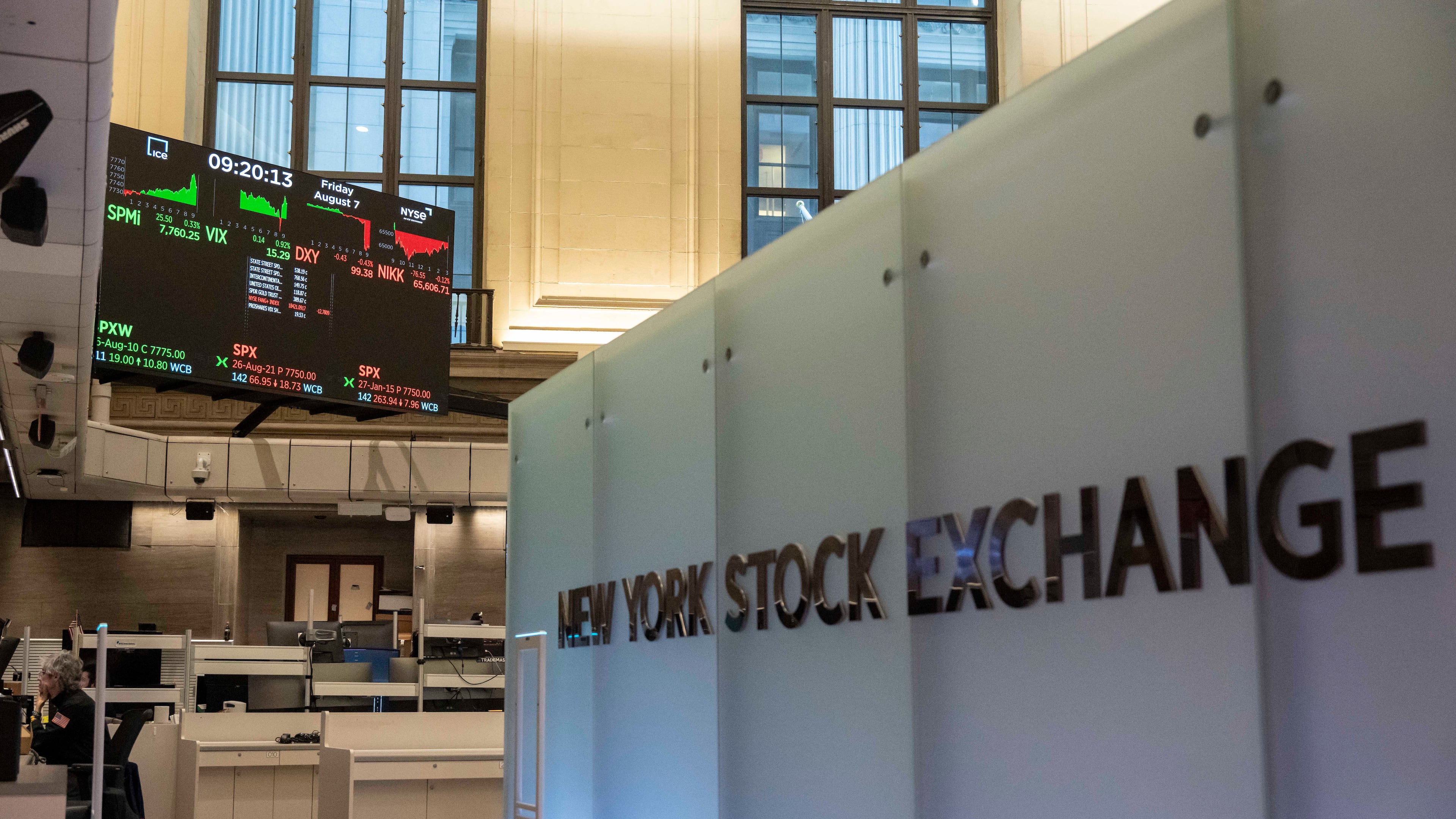 Financial information is displayed on the screen on the floor of the New York Stock Exchange, Friday, Aug. 7, 2026, in New York. (AP Photo/Yuki Iwamura)