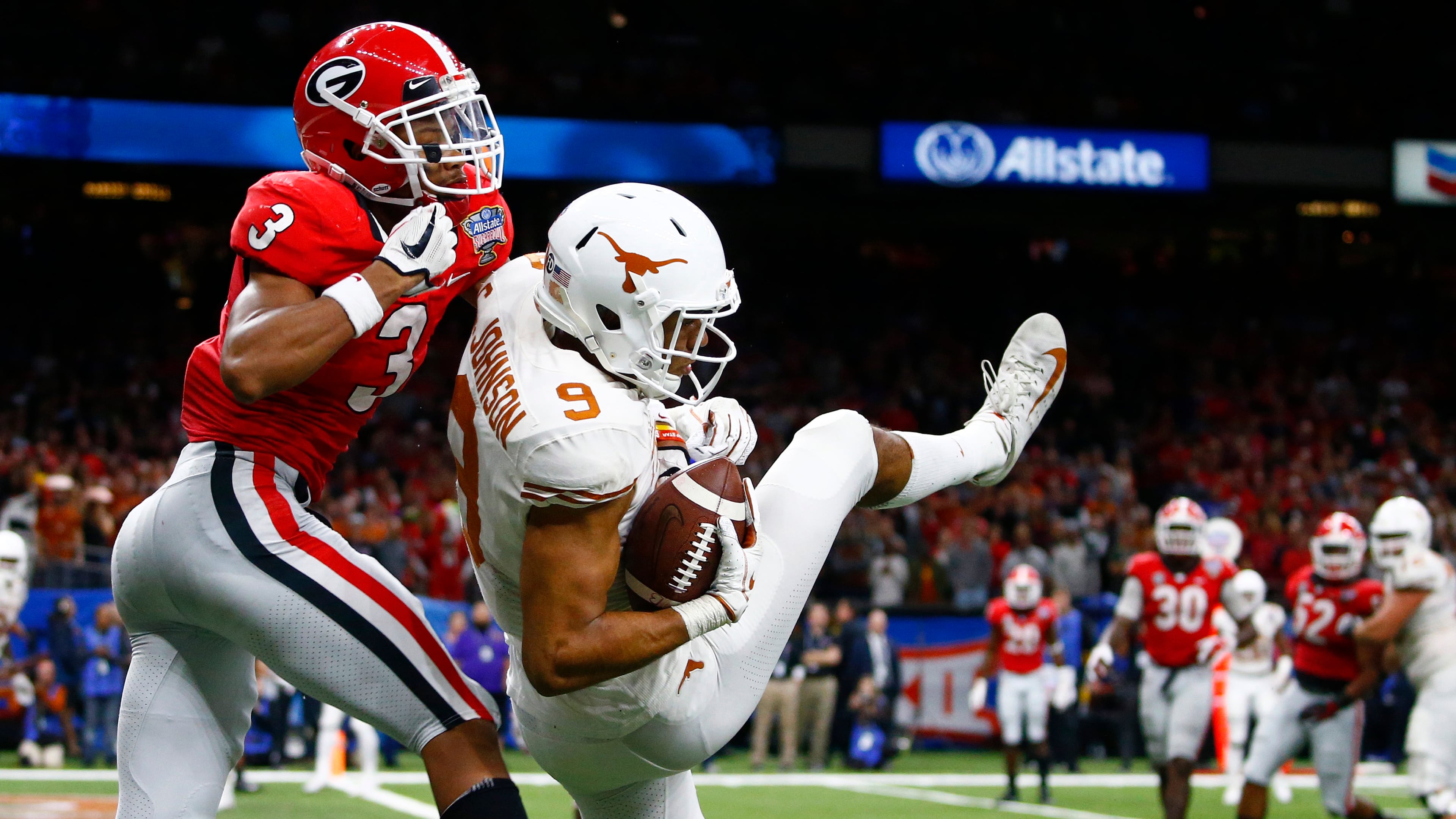 Texas wide receiver Collin Johnson (9) pulls in a 2-point conversion against Georgia defensive back Tyson Campbell (3) during the second half of the Sugar Bowl NCAA college football game in New Orleans, Tuesday, Jan. 1, 2019. (AP Photo/Butch Dill)