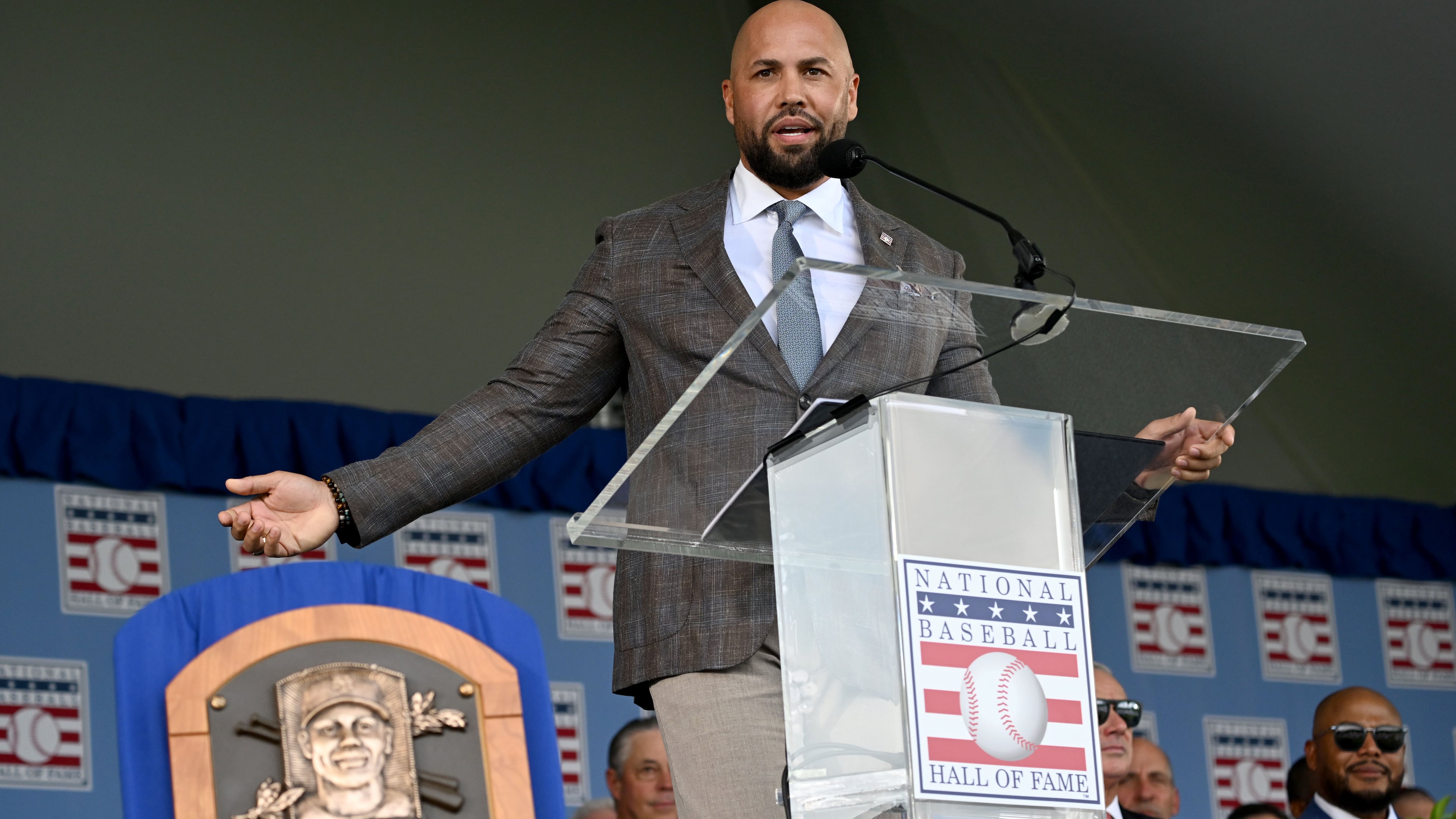 Carlos Beltrán speaks after being inducted into the National Baseball Hall of Fame during the 2026 National Baseball Hall of Fame Induction Ceremony at the Clark Sports Center on Sunday, July 26, 2026, in Cooperstown, N.Y. Braves centerfielder Andruw Jones is set for induction into the National Baseball Hall of Fame as part of the Class of 2026, alongside Carlos Beltrán and Jeff Kent. (Hyosub Shin/AJC)