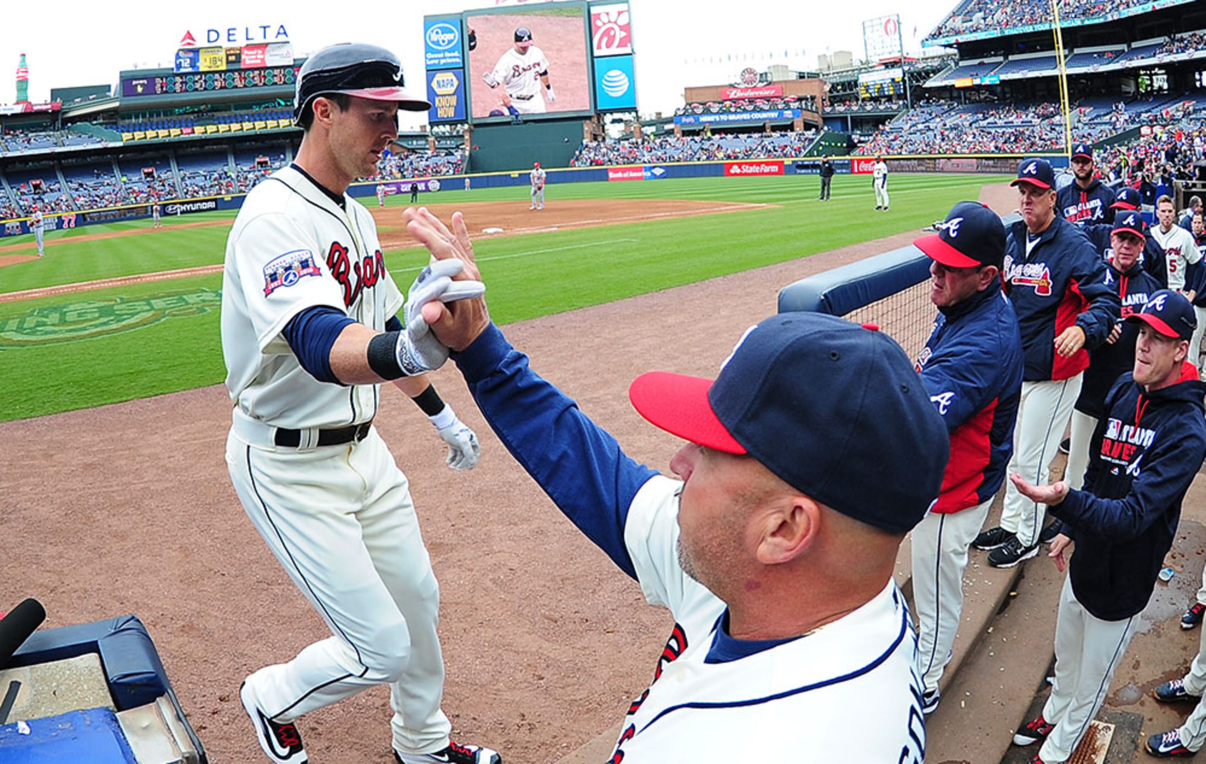Outfielder Drew Stubbs (2) is congratulated by manager Fredi Gonzalez after hitting a fourth inning three-run home run against the St. Louis Cardinals at Turner Field on April 10, 2016 in Atlanta.