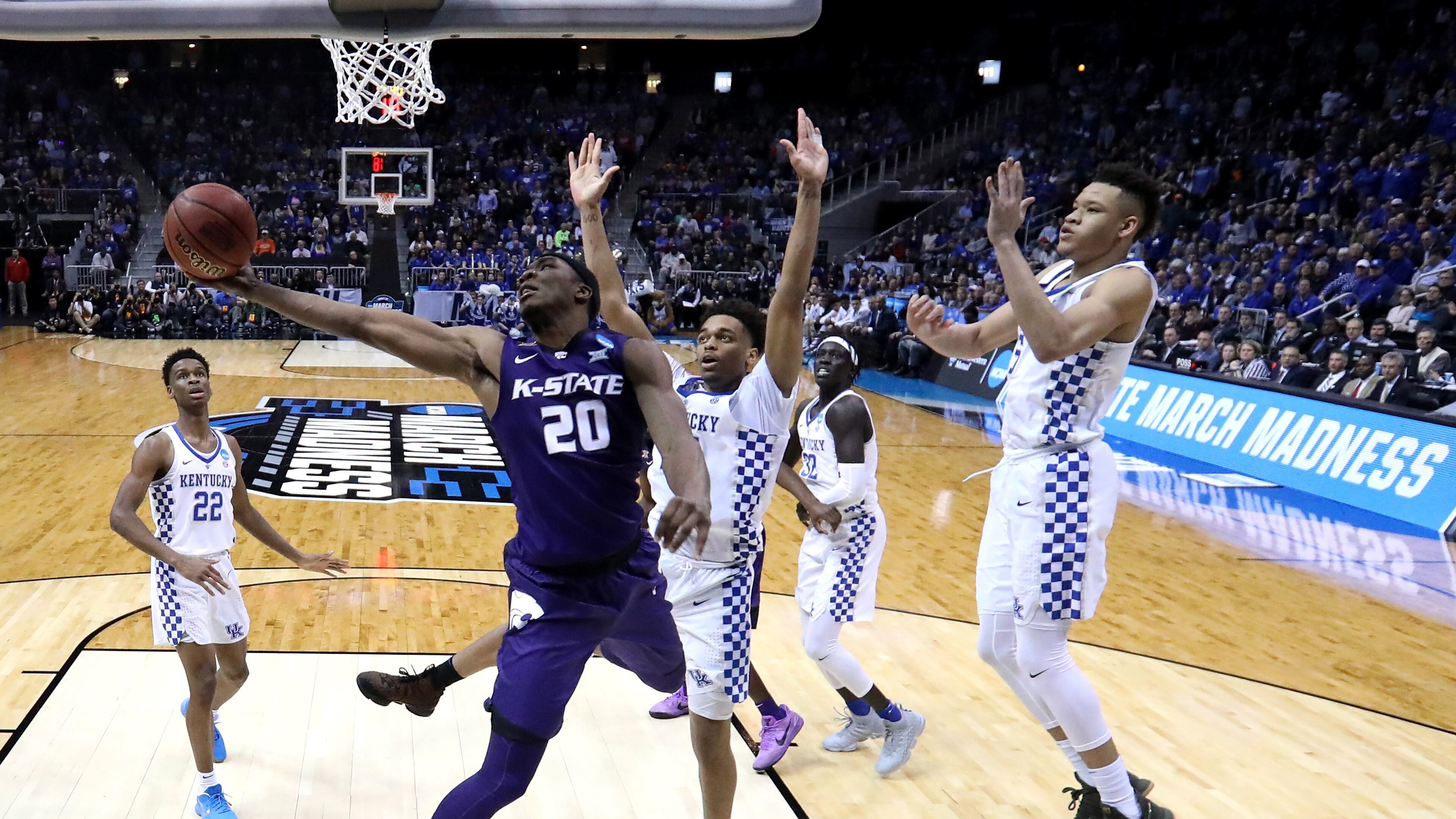 Against Kentucky, Kansas State's Xavier Sneed demonstrates that one's reach should always exceed one's grasp. (Ronald Martinez/Getty Images)