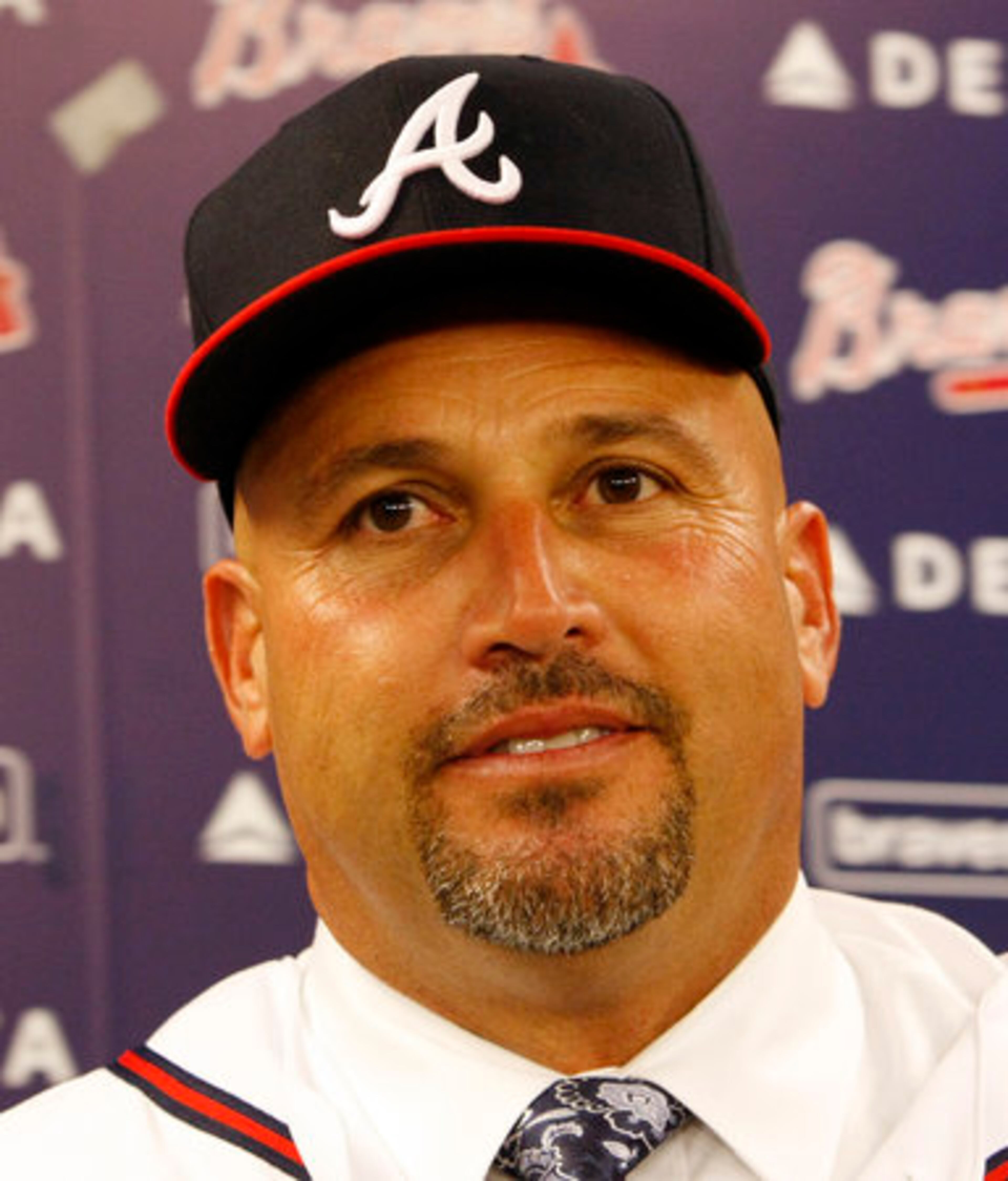 Fredi Gonzalez sports the Braves ball cap when he is named as new manager in the auxillary clubhouse at Turner Field in Atlanta on Wednesday, Oct. 13, 2010.