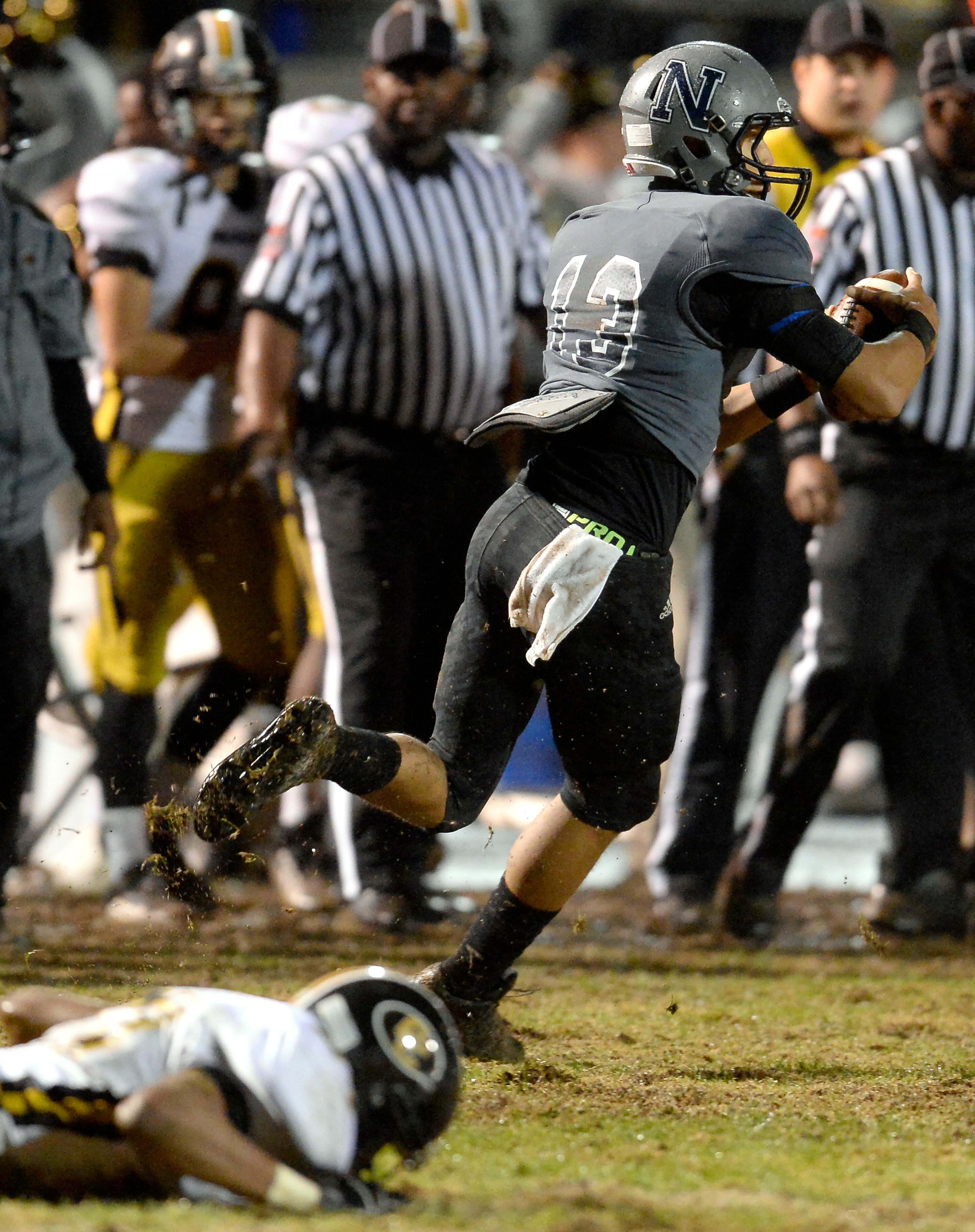 Norcross defensive back Jordan Noil (13) makes the interception to end any chance of a Colquitt comeback with less than a minute to play in the second half of their AAAAAA semifinal game at Blue Devil Stadium on Friday, Dec. 6, 2013, in Norcross, Ga.