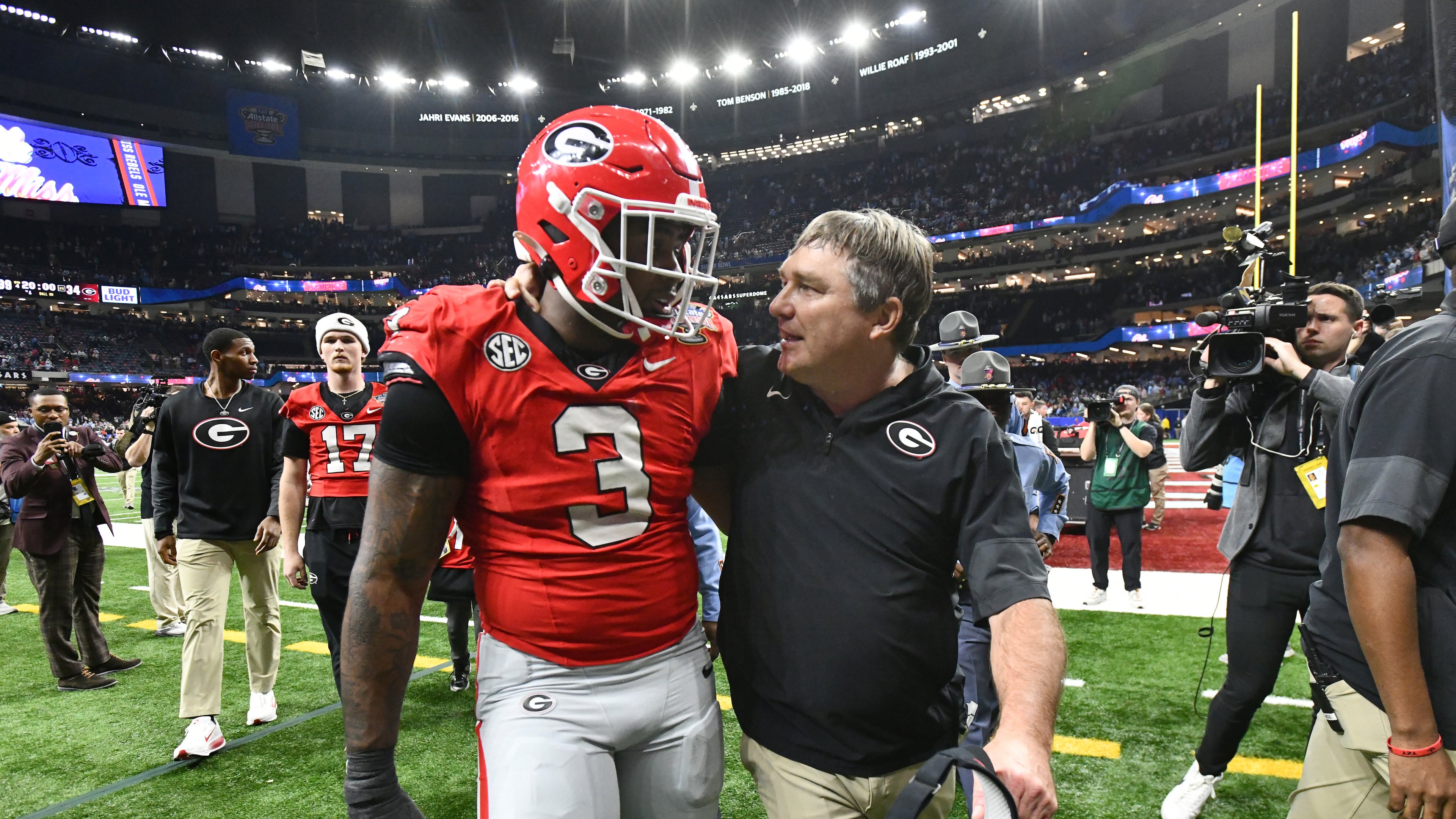 Georgia head coach Kirby Smart comforts Georgia linebacker CJ Allen as they leave after Ole Miss beat Georgia during the Sugar Bowl NCAA college football playoff quarterfinal game at the Caesars Superdome, Thursday, Jan. 1, 2026, in New Orleans. (Hyosub Shin/AJC)