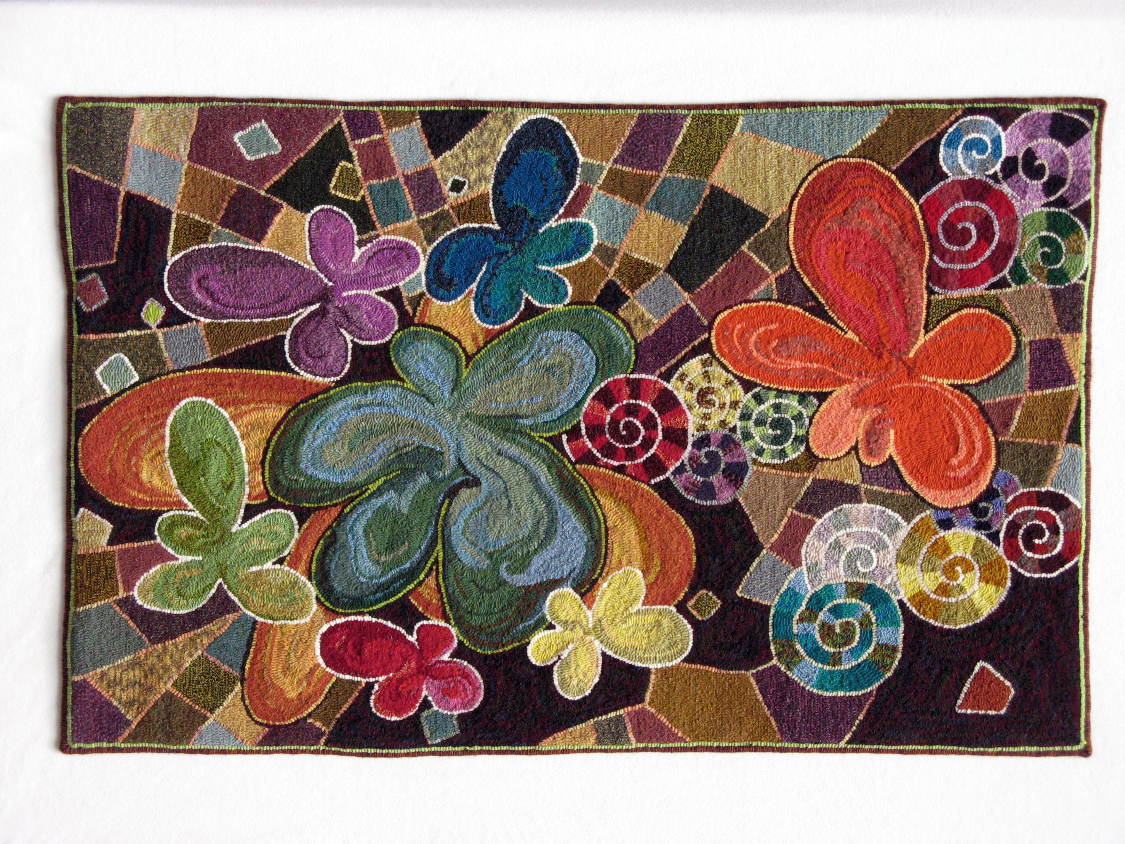 See decorative fiber works such as the hooked wool rug "Motiff Madness" -- in this case, flowers being the motiff -- by Lori Lupe Pelish of Niskayuna, N.Y.