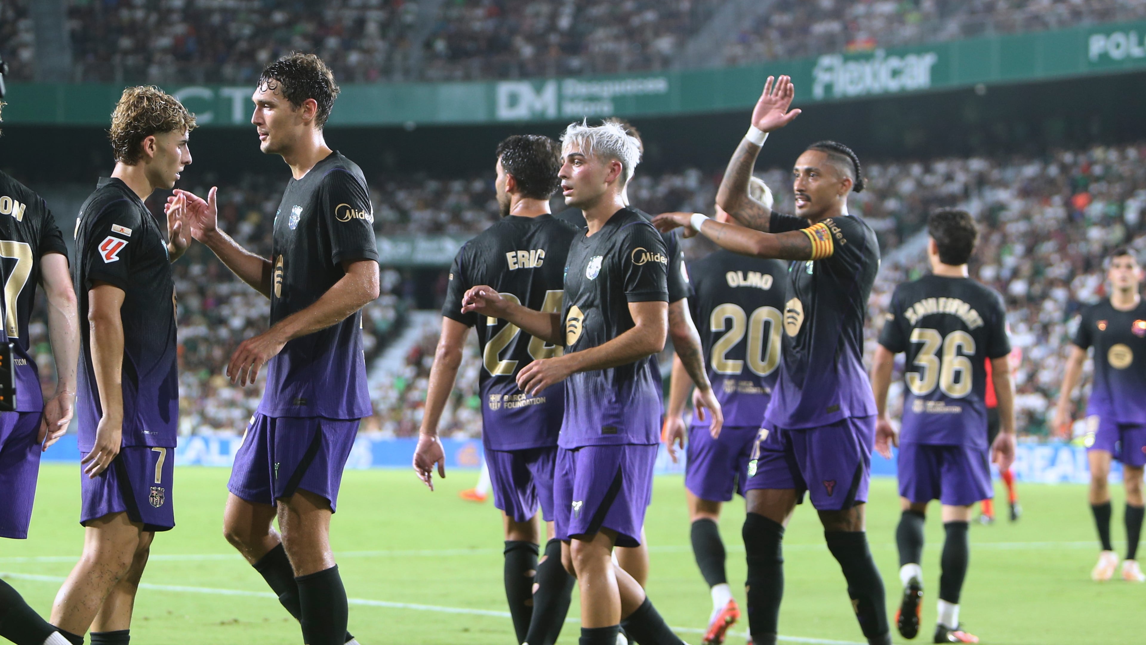 Barcelona's Fermin Lopez, left, celebrates after scoring his side's his fifth goal during a Spanish La Liga soccer match between Elche and Barcelona in Elche, Spain, Sunday, Aug. 23, 2026. (AP Photo/Alberto Saiz)