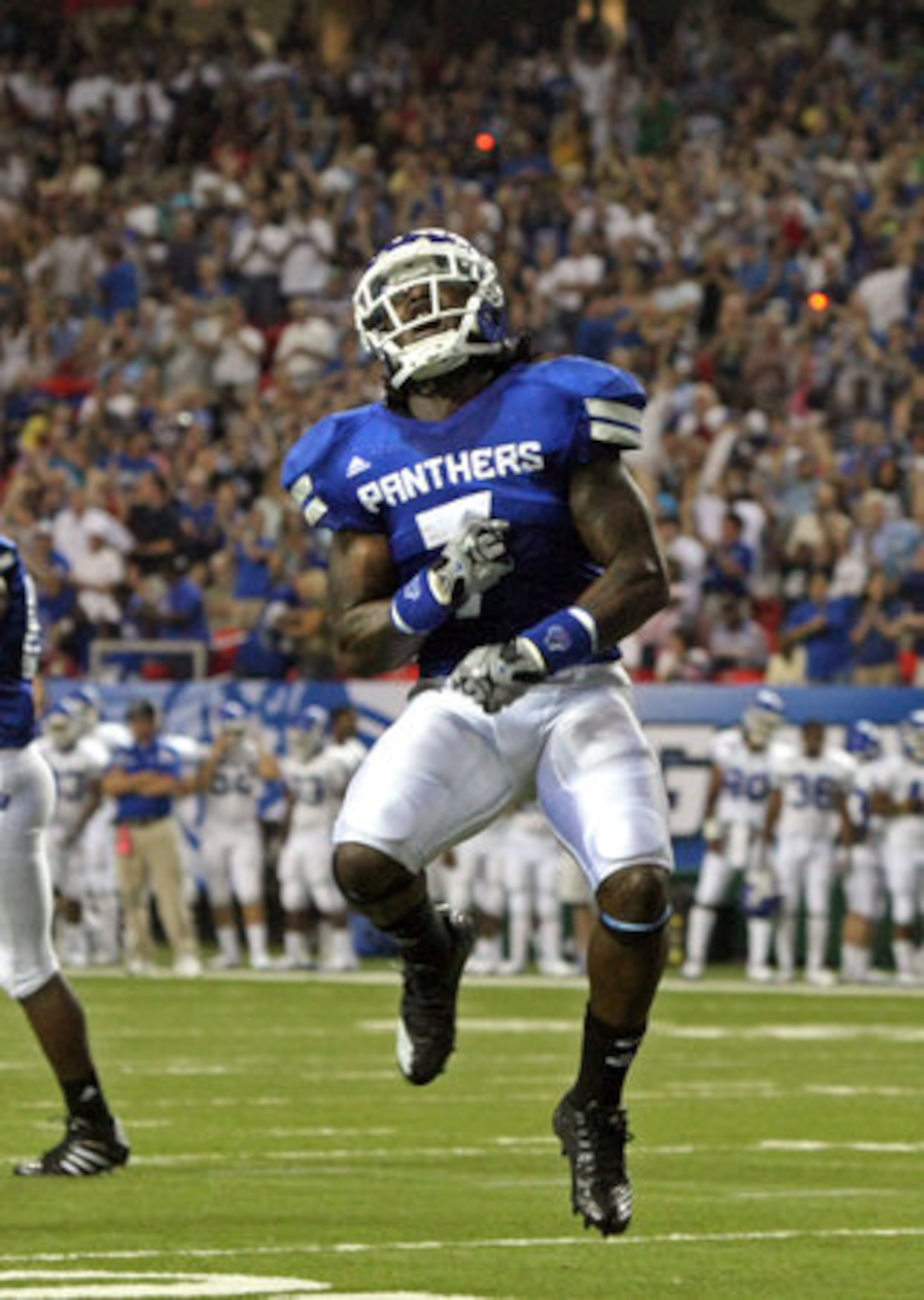 GSU running back Parris Lee (7) celebrates his touchdown and GSU's first ever touchdown on a 4-yard run in the first quarter of their game against Shorter College in the Georgia Dome Thursday night in Atlanta, Ga., Sept. 2, 2010.