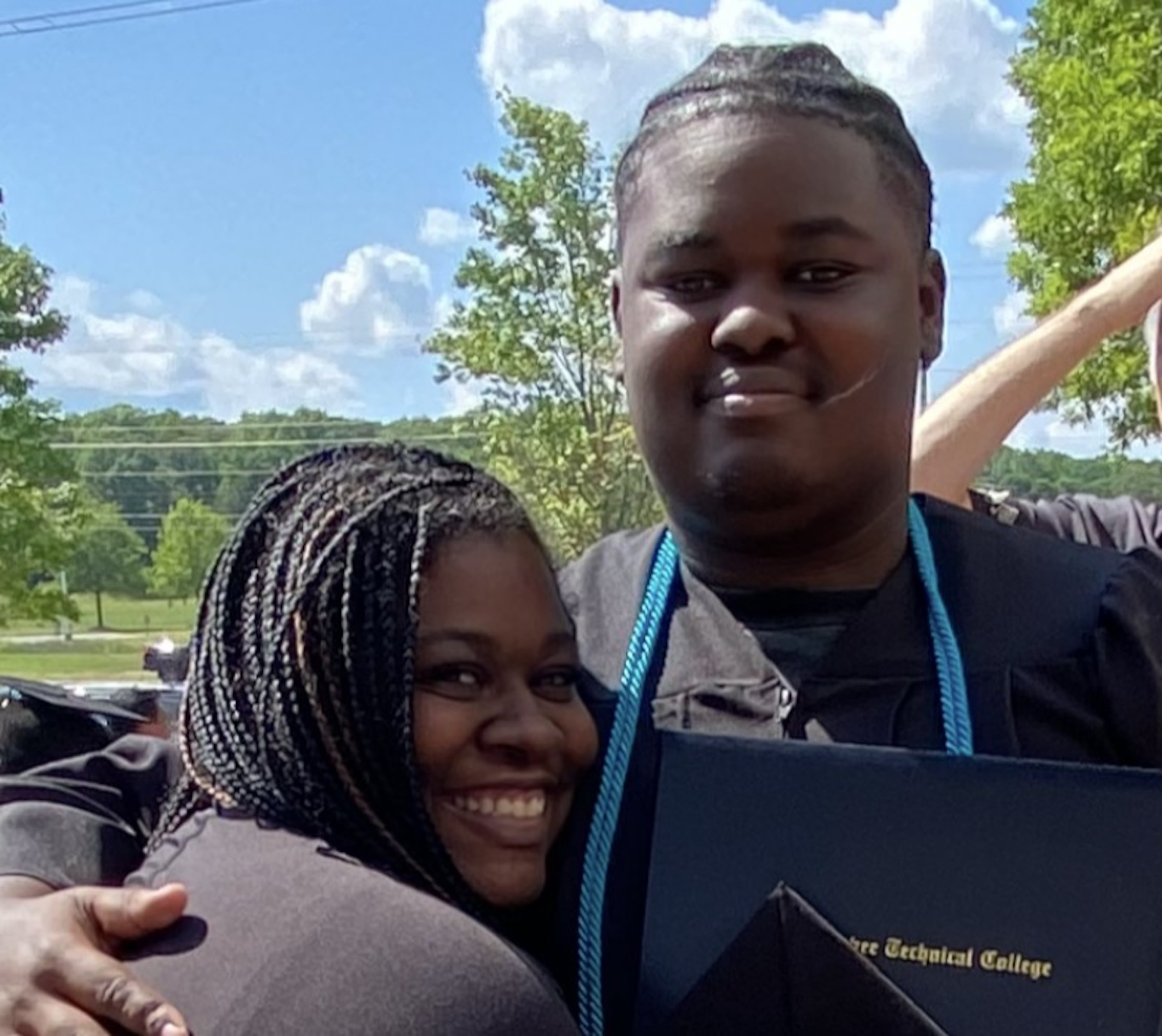Karman Jacobo and her son, Kayden, pose for a picture during his graduation season in 2026. She said the cost of senior traditions -- everything from yearbooks to prom to caps and gowns -- quickly added up. (Photo courtesy Karman Jacobo)