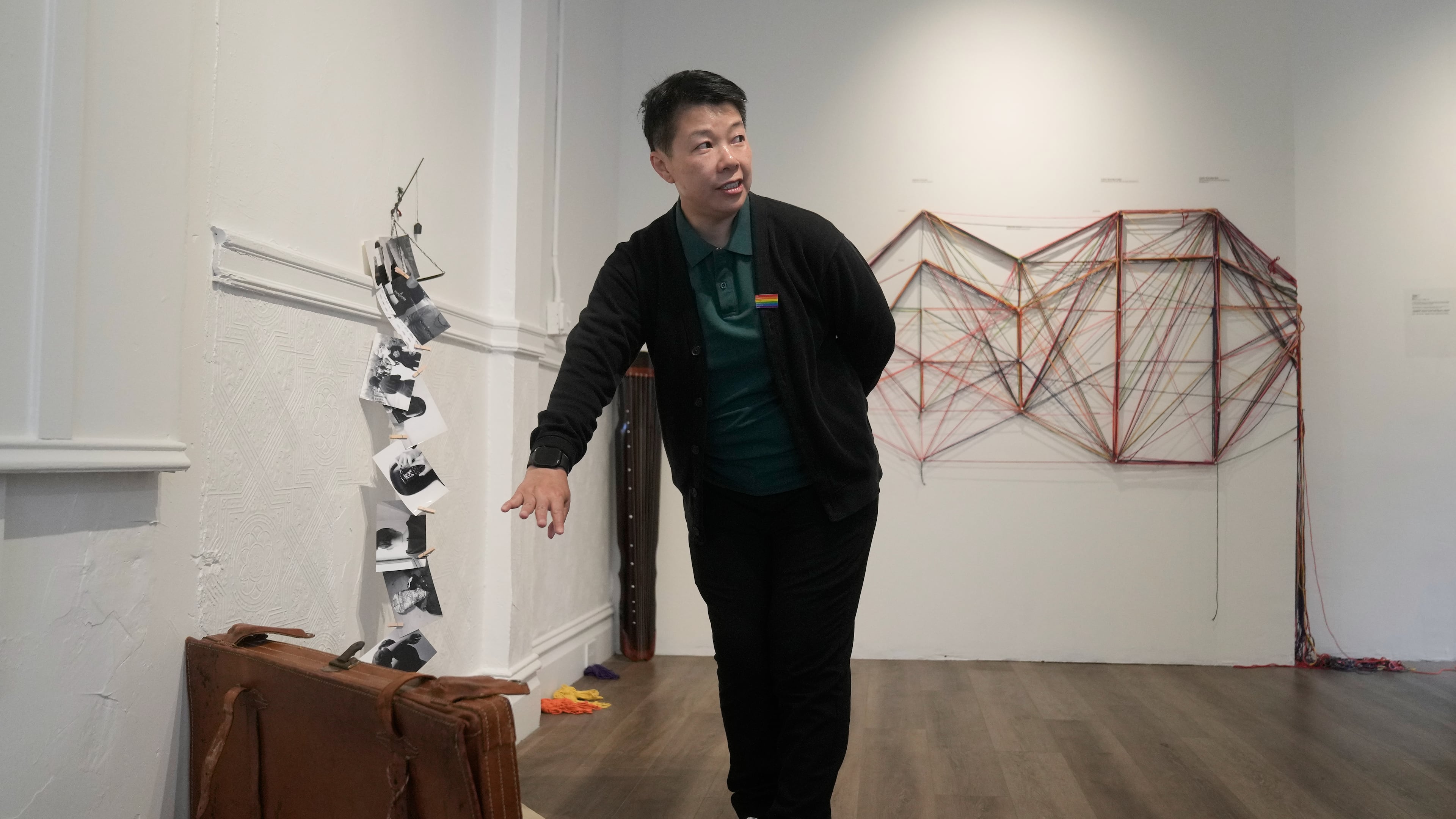 OUT Museum founder Xiangqi Chen gestures toward her art piece, "The Weight of Kindness," displayed at the Chinatown museum, Monday, June 22, 2026, in San Francisco. (AP Photo/Jeff Chiu)