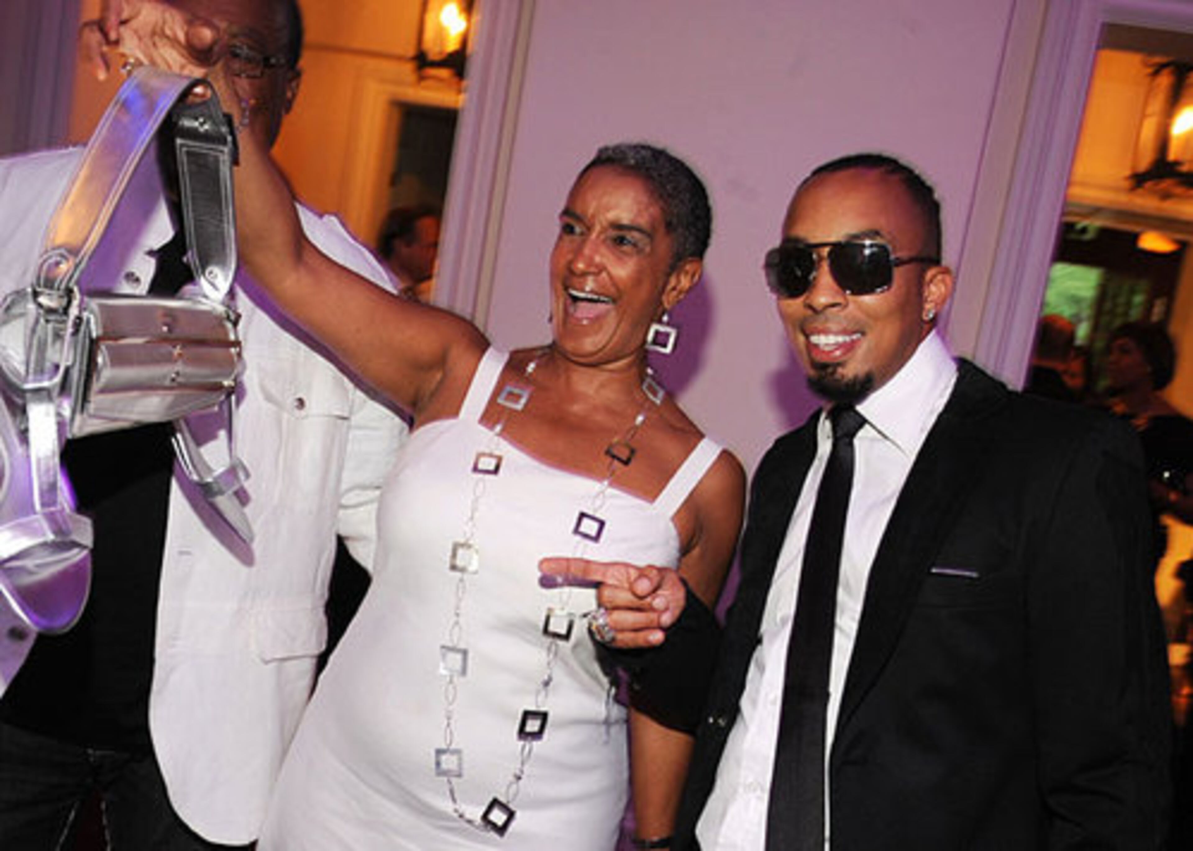 Dallas Austin parties with Atlanta culture affairs director Camille Love.