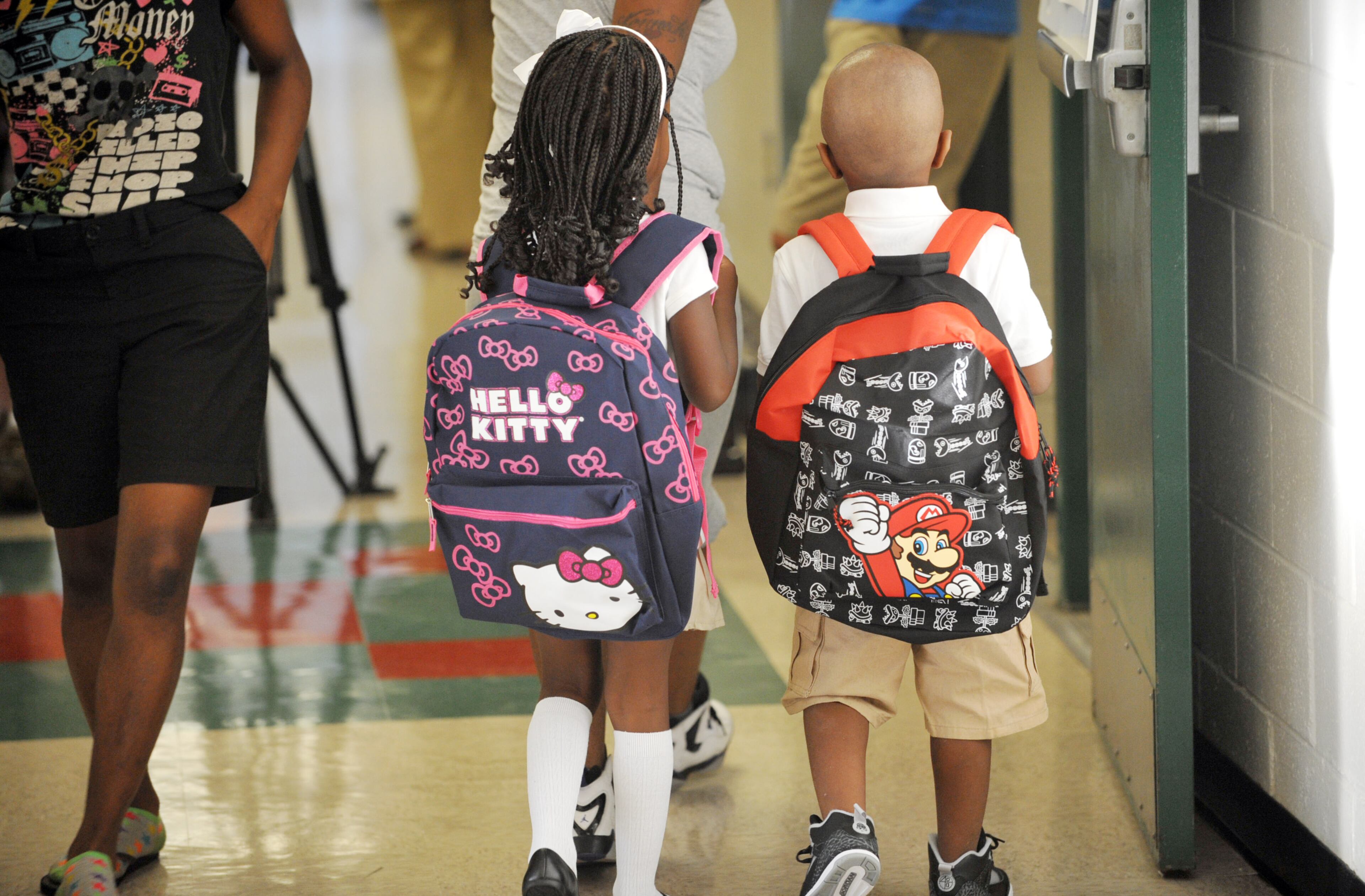 Students walk to classes as they start back to school at Bethune Elementary School in Atlanta on the first day of classes, Monday August 4, 2014. APS Superintendent Meria Carstarphen greeted students, parents, faculty and staff during the morning. KENT D. JOHNSON/KDJOHNSON@AJC.COM