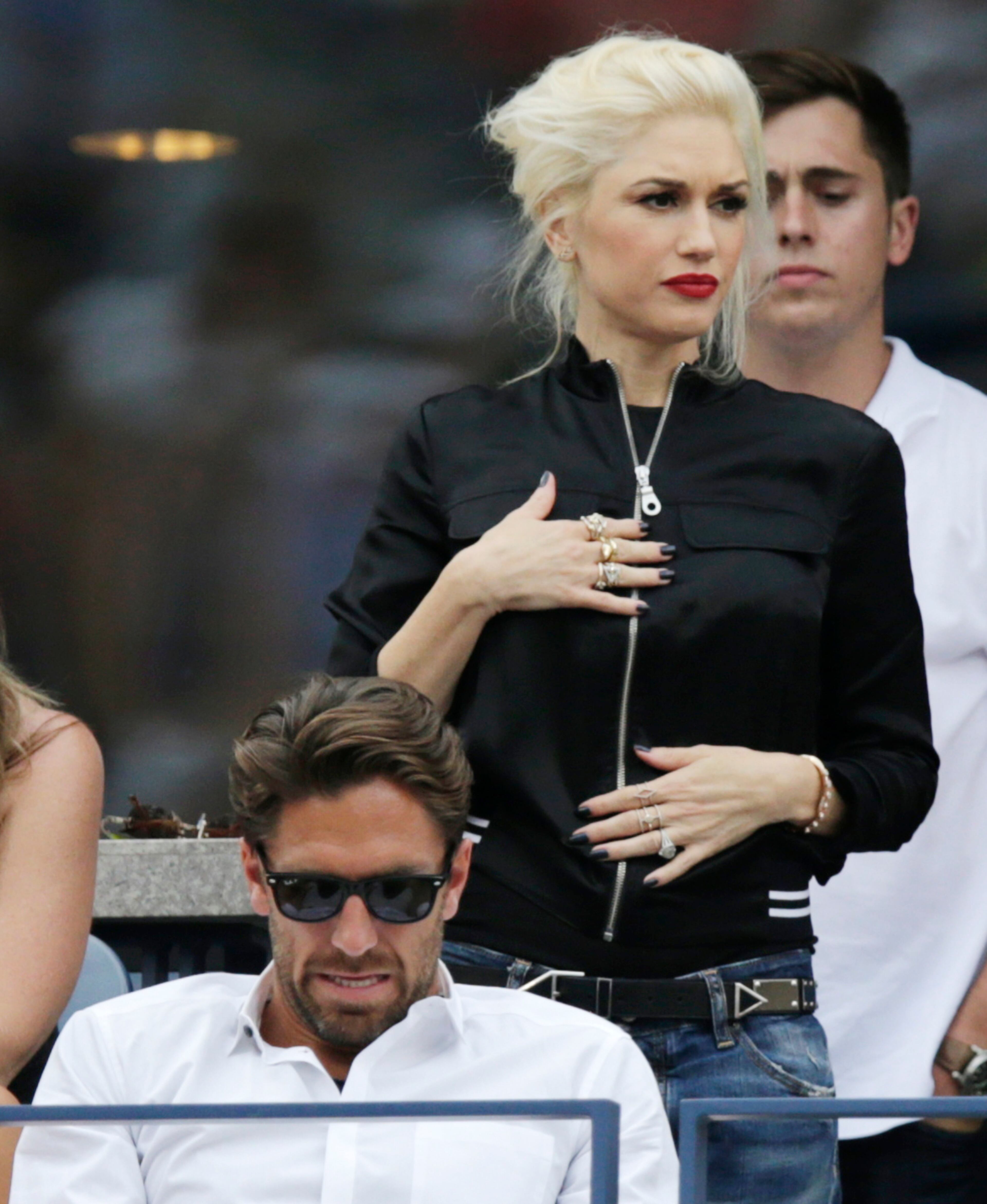 Gwen Stefani watches play between Roger Federer, of Switzerland, and Marin Cilic, of Croatia, during the semifinals of the 2014 U.S. Open tennis tournament, Saturday, Sept. 6, 2014, in New York. (AP Photo/Charles Krupa)