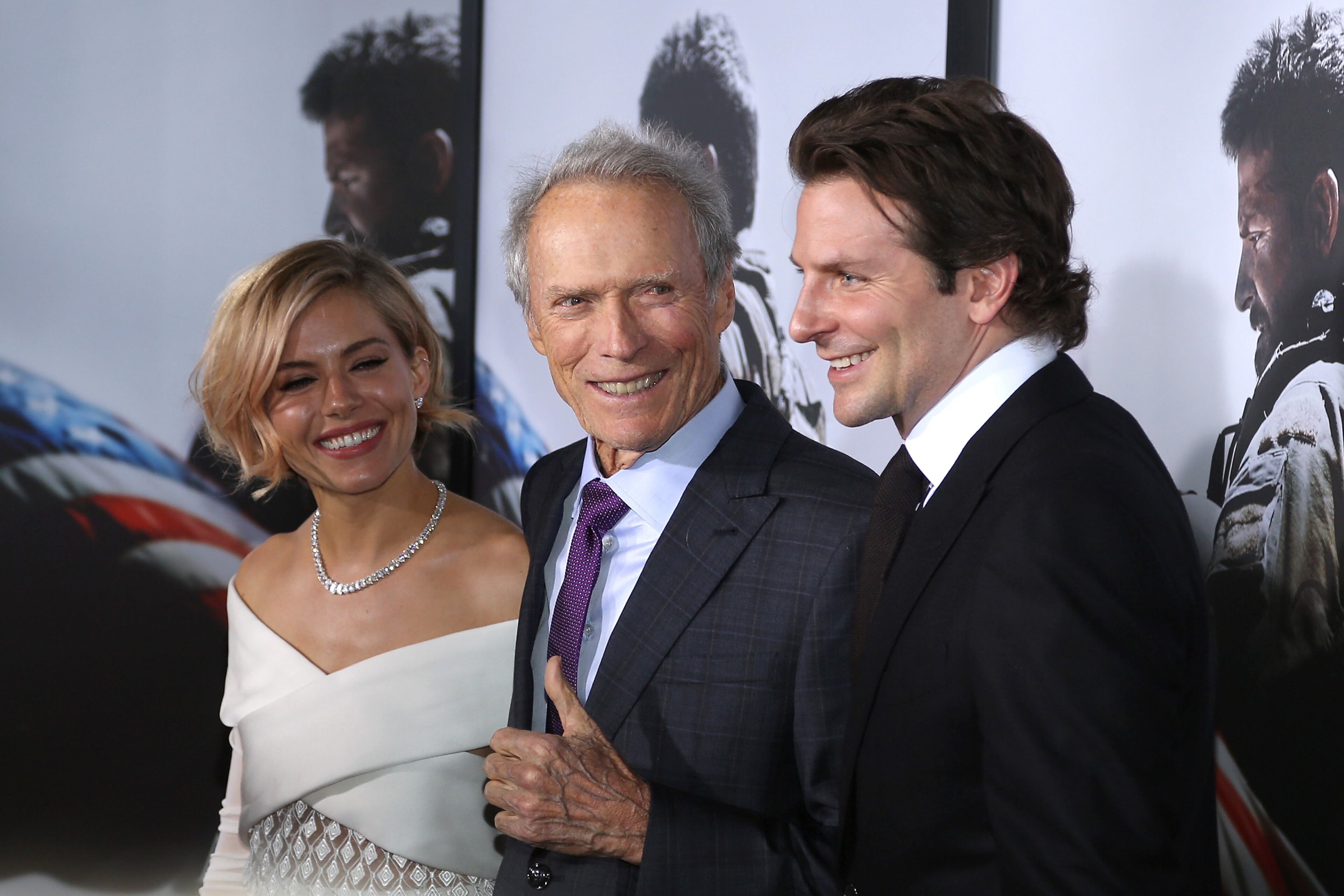 NEW YORK, NY - DECEMBER 15: (L-R) Sienna Miller, Clint Eastwood, Bradley Cooper arrive at the "American Sniper" New York Premiere at Frederick P. Rose Hall, Jazz at Lincoln Center on December 15, 2014 in New York City. (Photo by Rob Kim/Getty Images)