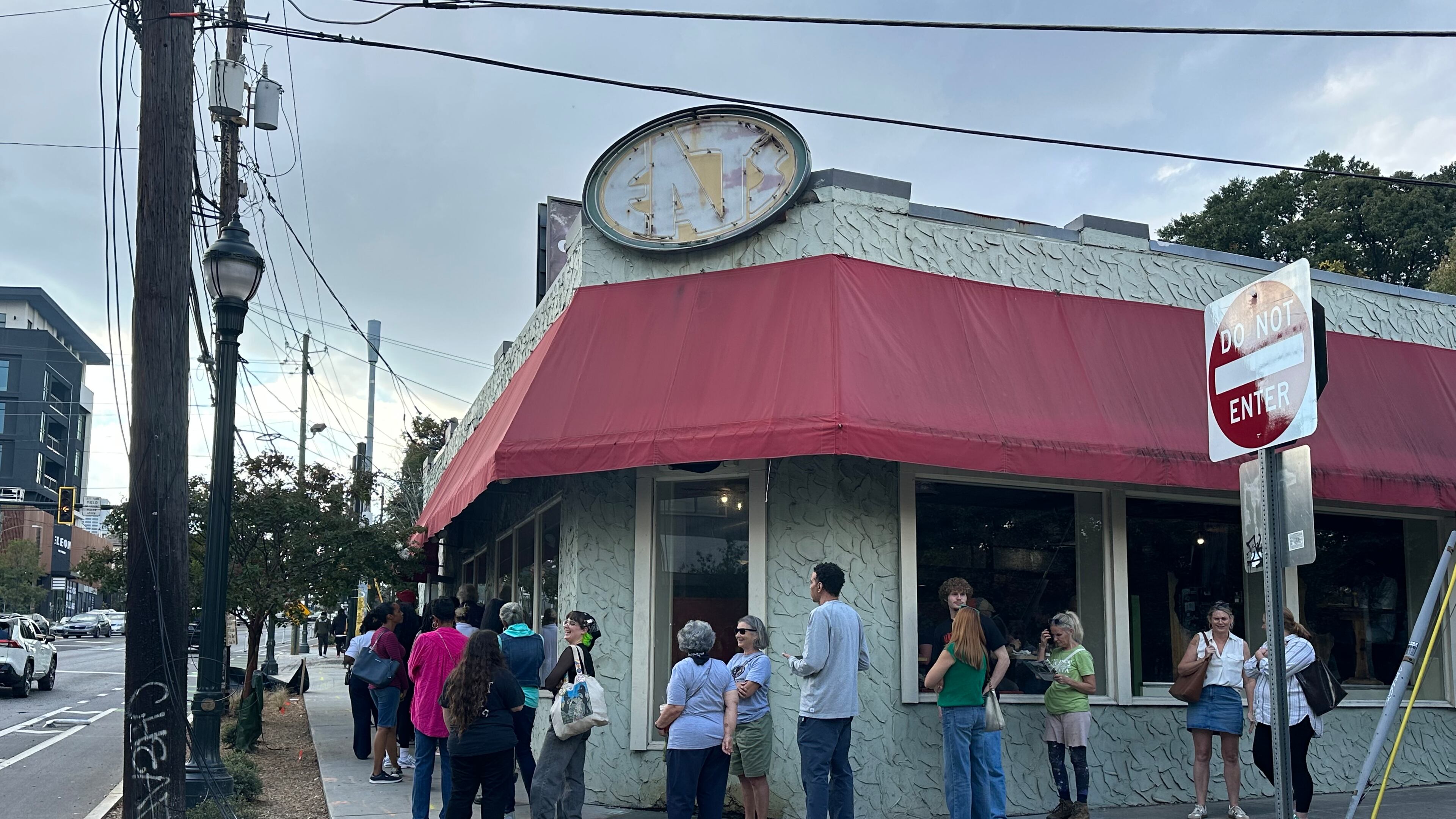 A long line forms outside Eats on its final day of business Saturday, Oct. 18, 2025, on Ponce de Leon Avenue in Atlanta. Bob Hatcher announced Oct. 3 that the restaurant would close after 32 years. (Amy Wenk/AJC)