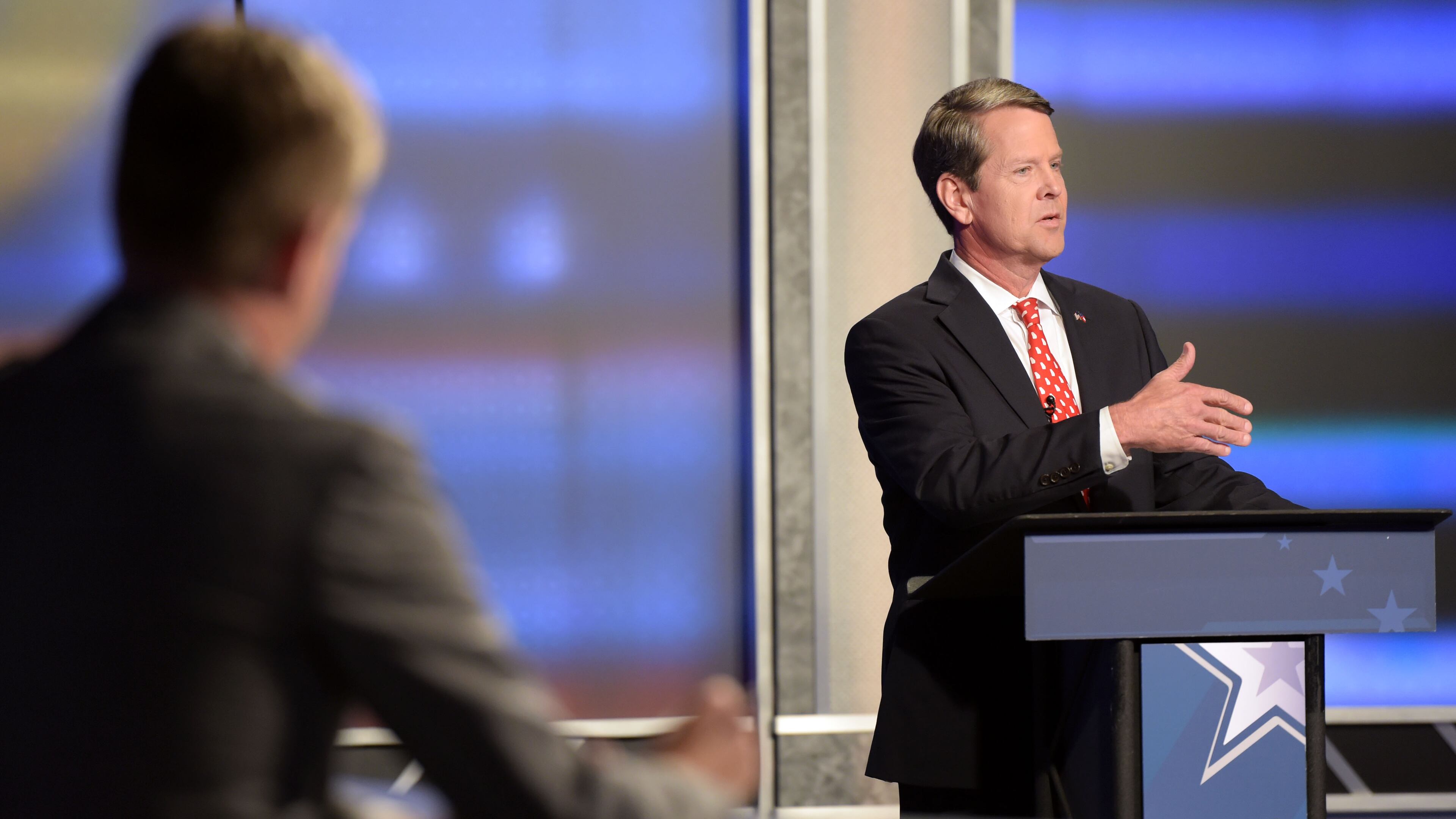 7/15/18 - Atlanta - Secretary of State Brian Kemp, right, speaks during the second and final televised debate with Lt. Gov. Casey Cagle at a Channel 2 Action News studio on Sunday, July 15. The runoff to decide the Republican candidate for governor will be held July 24. Jenna Eason / Jenna.Eason@coxinc.com