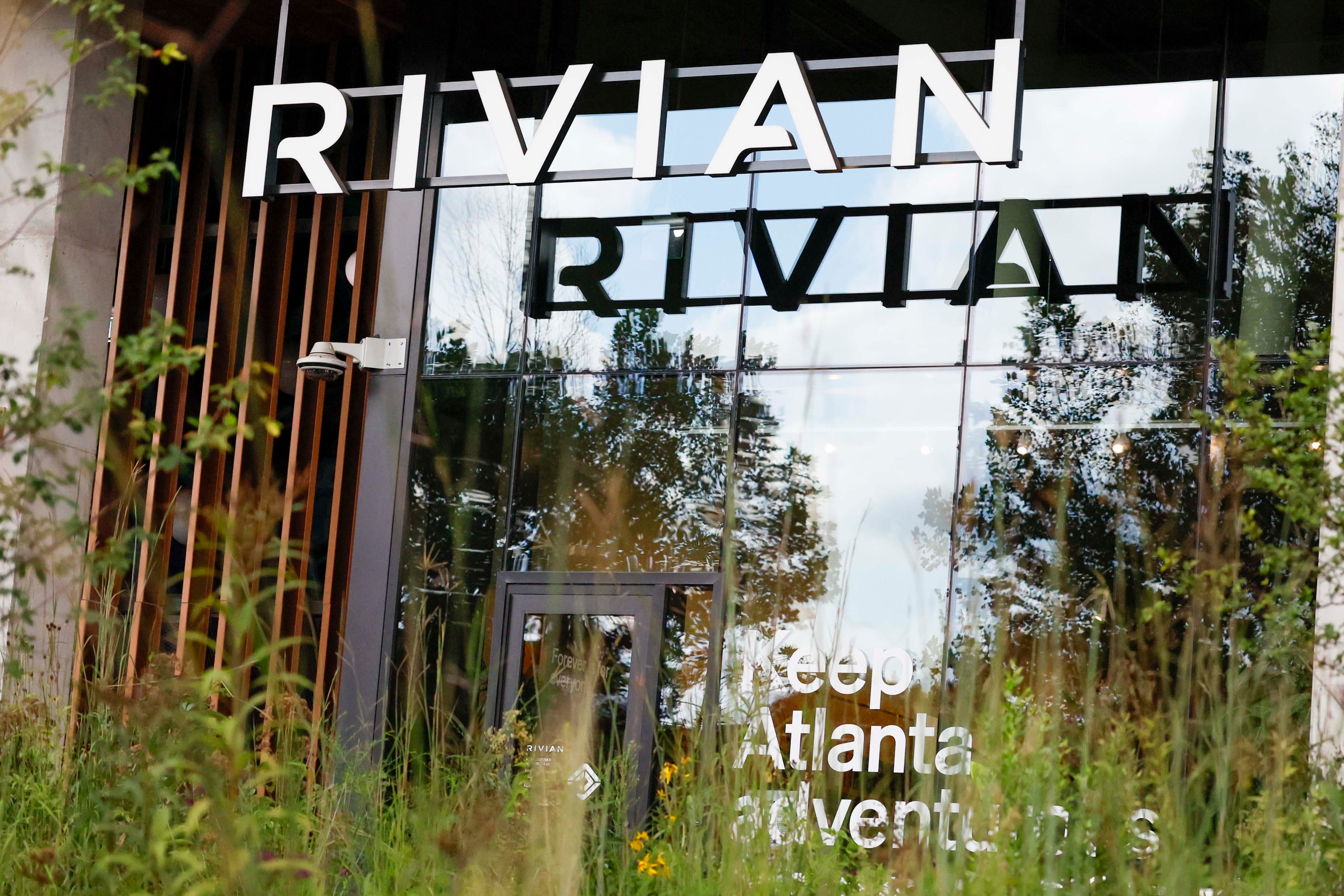 A Rivian logo is displayed at the front of their new headquarters near Krog Street Market on Tuesday, August 4, 2026. Rivian’s headquarters employs 130 people and is projected to grow to 500 by 2030. (Miguel Martinez/AJC)