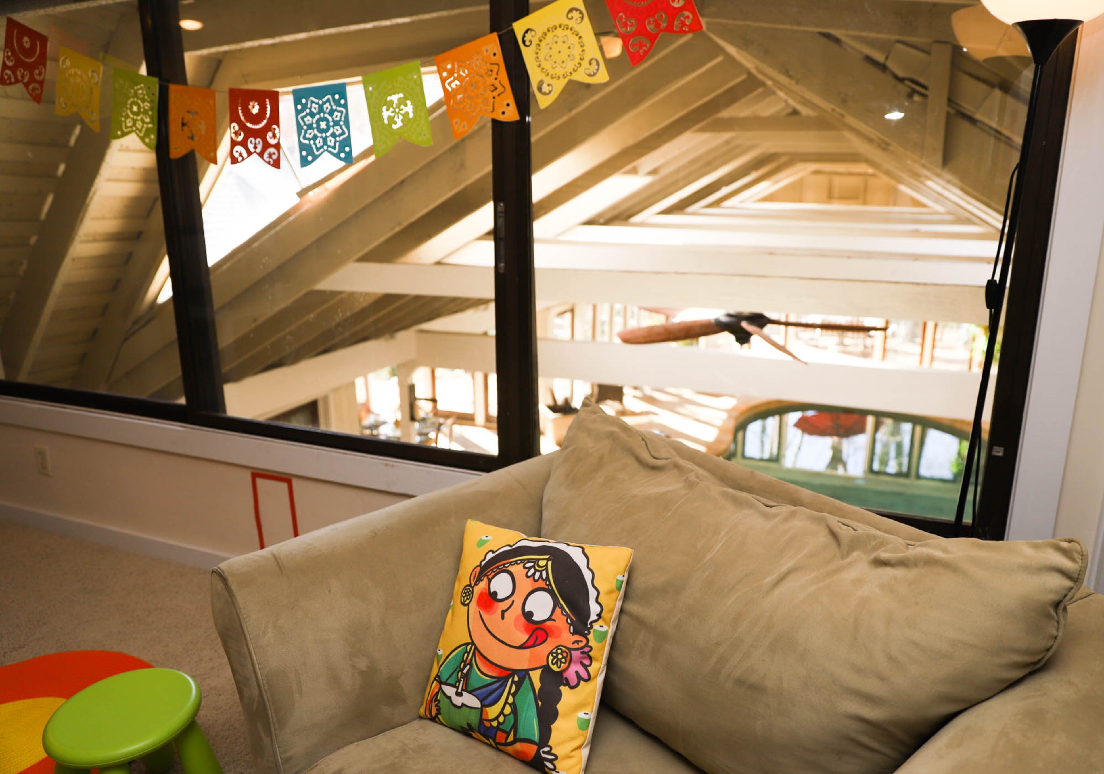 Kids should have the freedom to be creative, said Sugandha Rosenhaft, an art educator. The loft overlooking the pool room gives her children their own space for play and artistic endeavors.