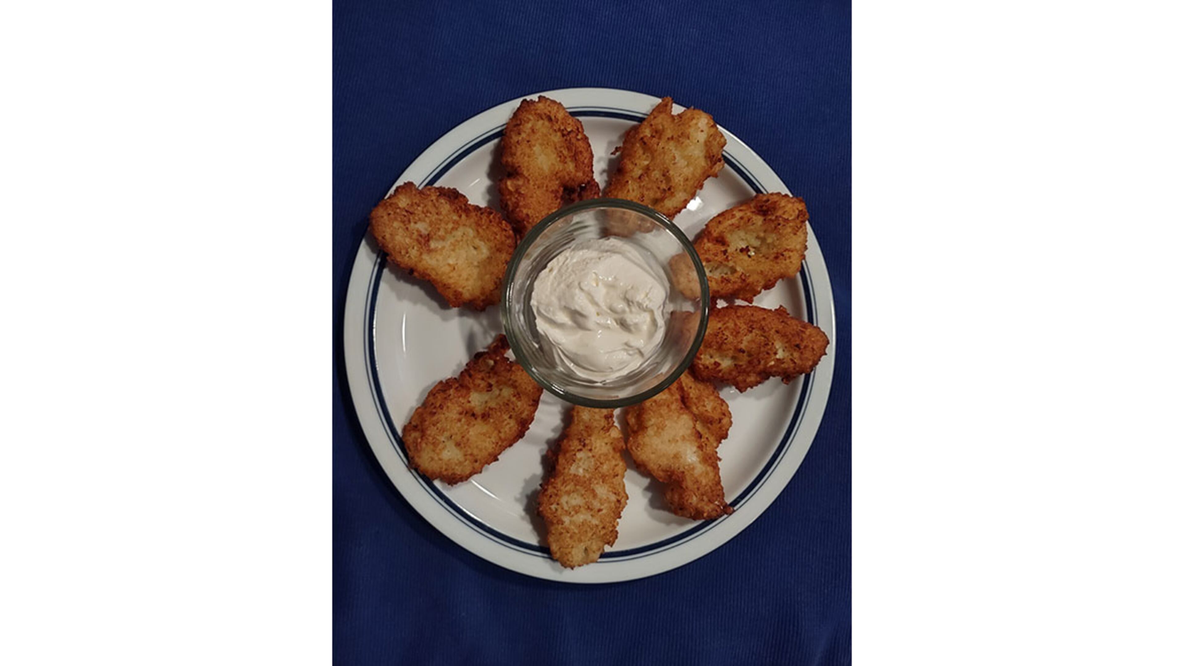 Latkes from the Hanukkah menu of Petit Chou. / Courtesy of Petit Chou