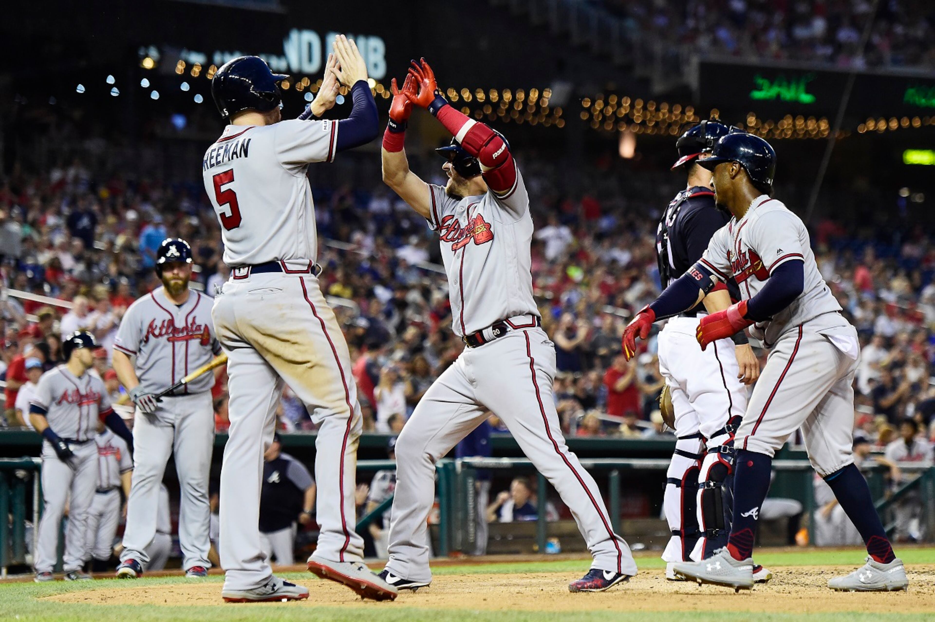 Josh Donaldson #20 of the Atlanta Braves celebrates with his teammates after hitting a three-run home run in the fourth inning against the Washington Nationals at Nationals Park on July 30, 2019 in Washington, DC. (Photo by Patrick McDermott/Getty Images)