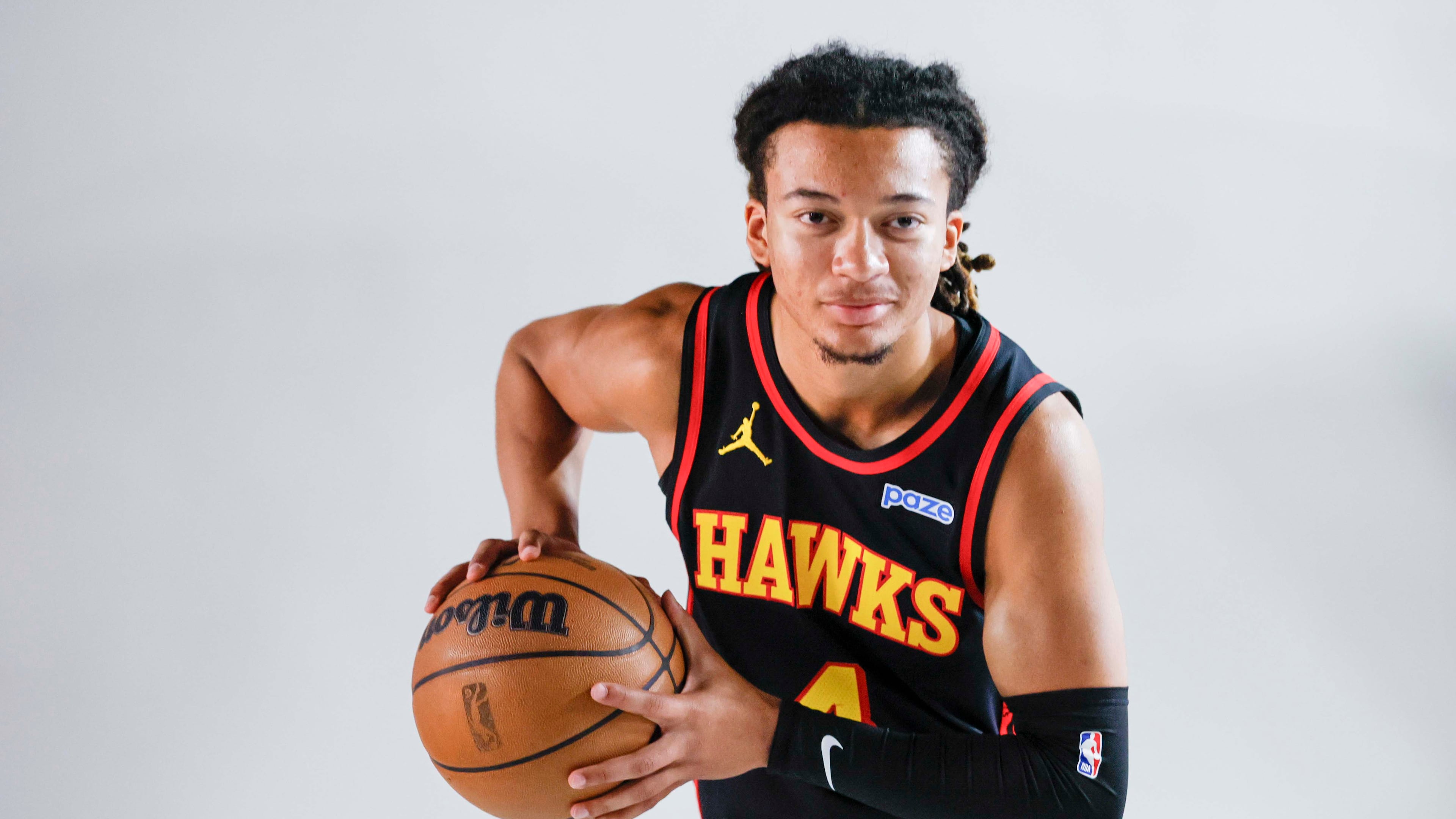 Atlanta Hawks guard Kingston Flemings holds the ball while posing for photos during the NBA team’s media day on Monday, Sept. 28, 2026. (Miguel Martinez/AJC)
