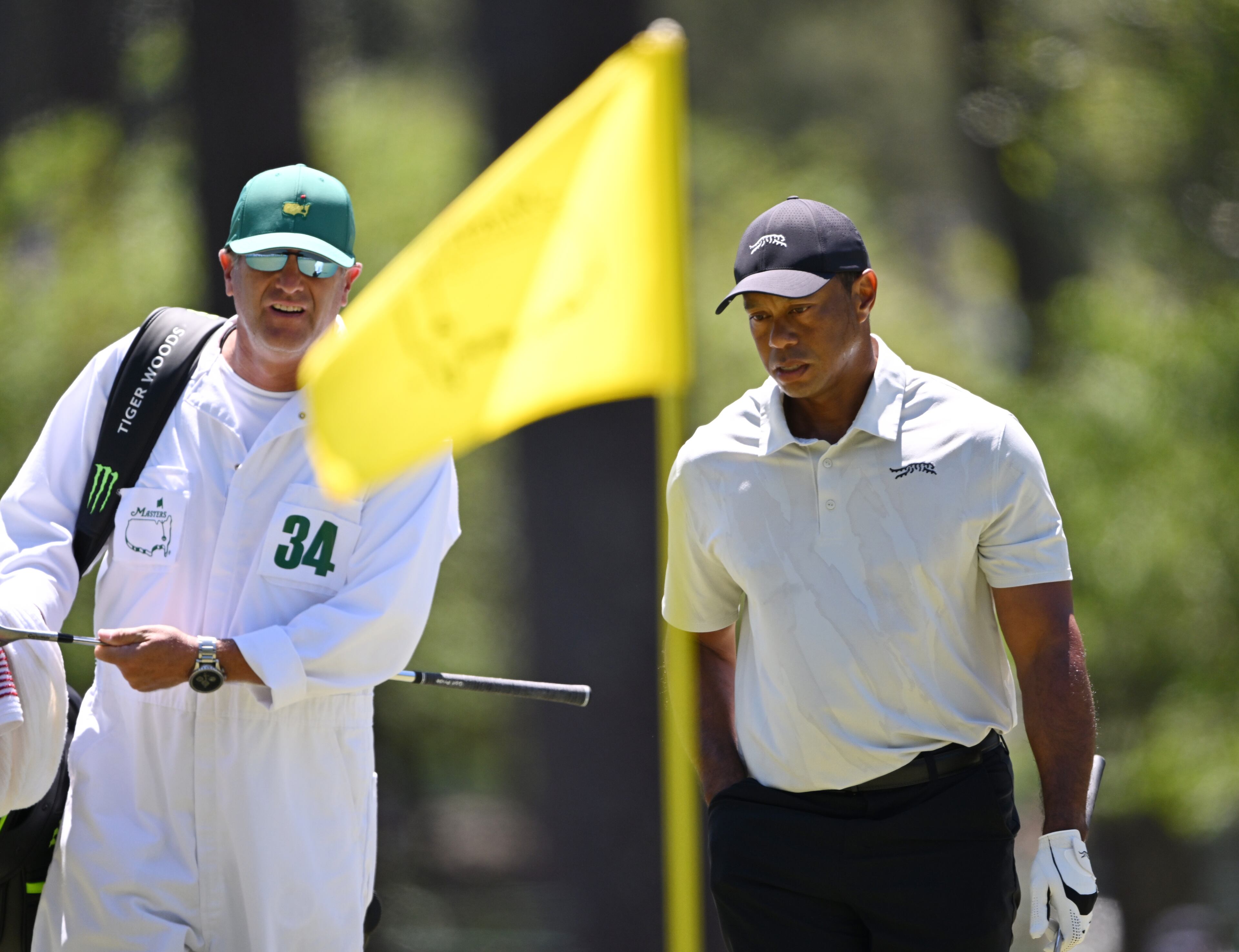 Tiger Woods and caddie Lance Bennett on third green during third round at the 2024 Masters Tournament at Augusta National Golf Club, Saturday, April 13, 2024, in Augusta, Ga. (Hyosub Shin / Hyosub.Shin@ajc.com)