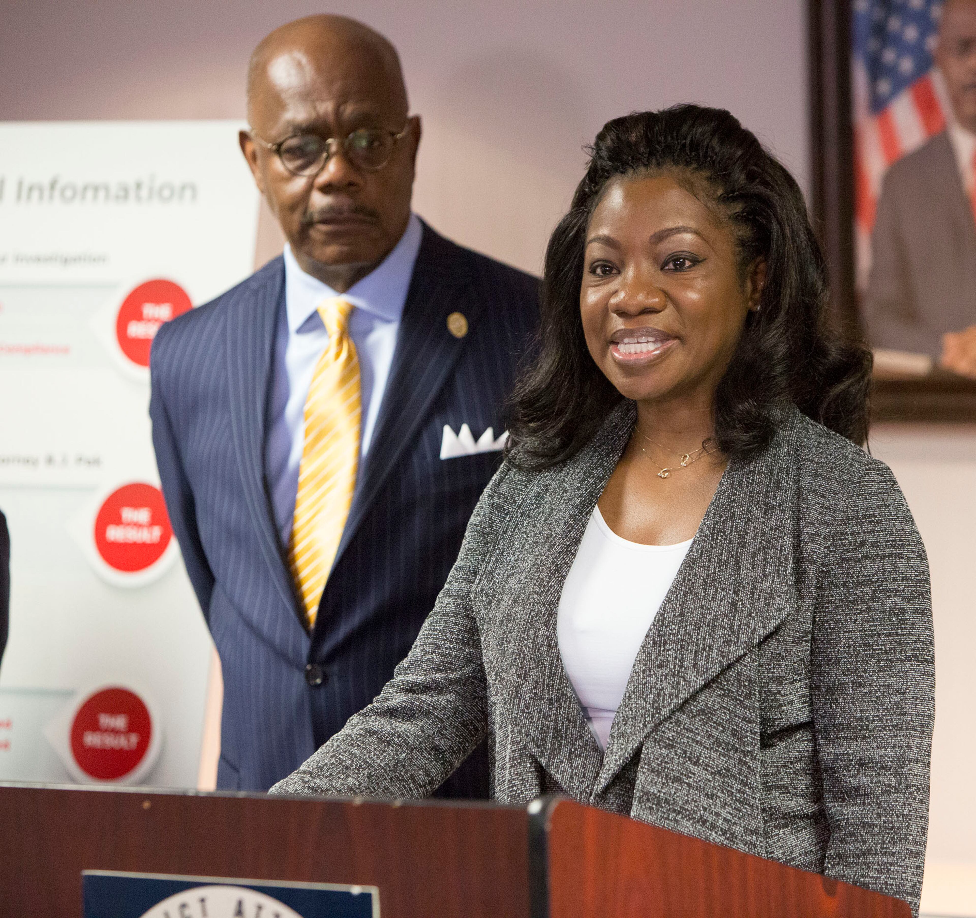 Fulton County District Attorney Paul L. Howard, Jr (left) listens as Monteria Robinson talks about the death of her son Jamarion Robinson. Howards announced the filing of a lawsuit against the United States Department of Justice in the death of her son during a press conference on December 28th, 2018. (Photo by Phil Skinner)