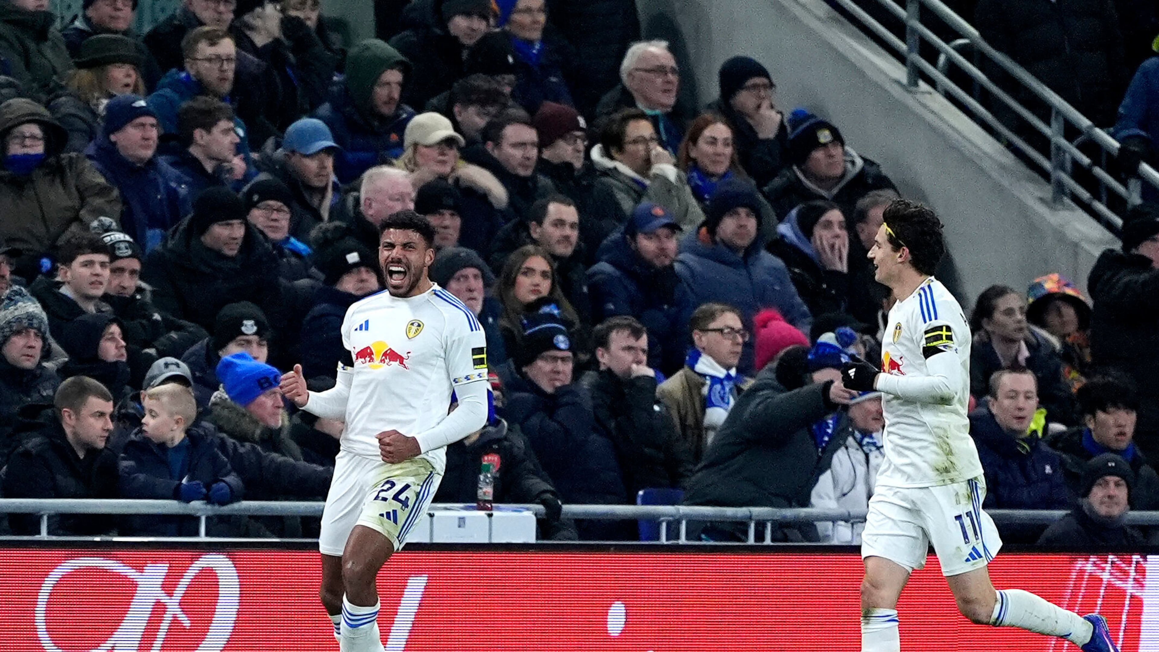 Leeds United's James Justin, left, celebrates scoring during the English Premier League soccer match between Everton and Leeds United in Liverpool, England, Monday Jan. 26, 2026. (Peter Byrne/PA via AP)