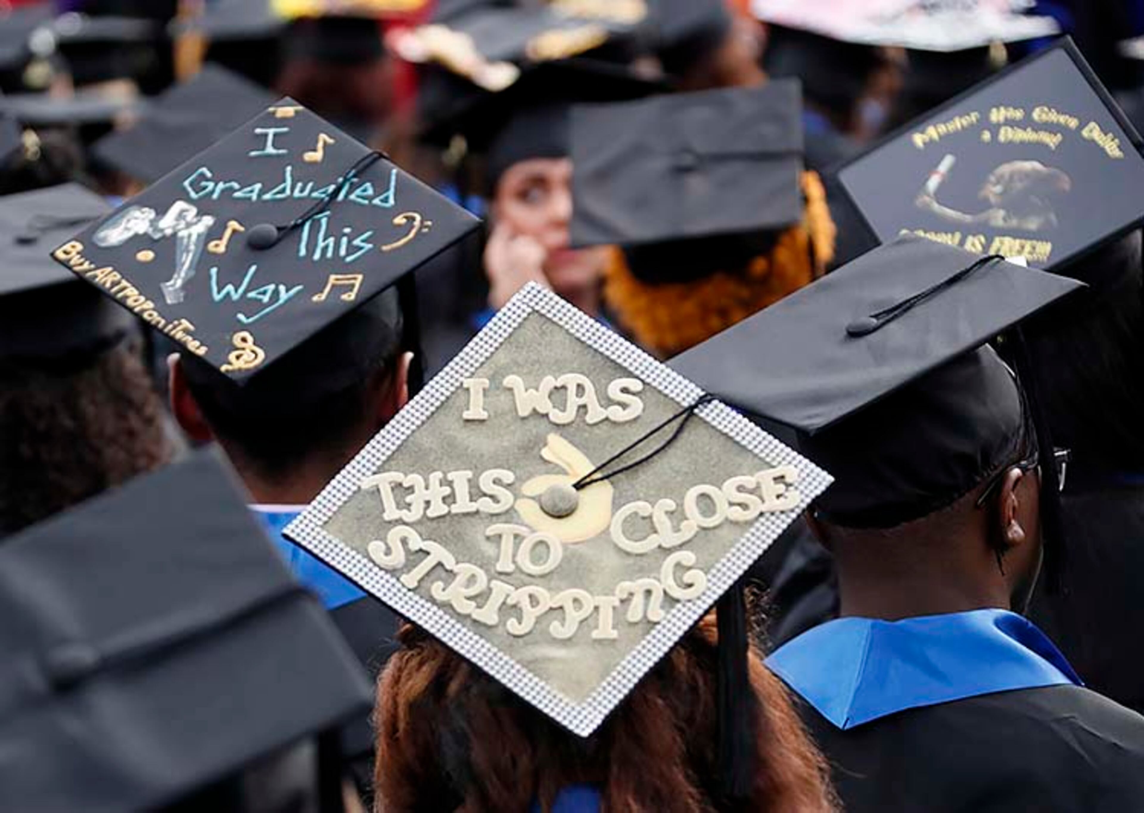May 9, 2019 - Atlanta - Many graduates sported personalized mortar board artwork. Georgia State University is hosting its 104th Commencement Monday, May 6 through Tuesday, May 14 at Panther Stadium in Atlanta. Six schools held their graduation on Thursday. Bob Andres / bandres@ajc.com