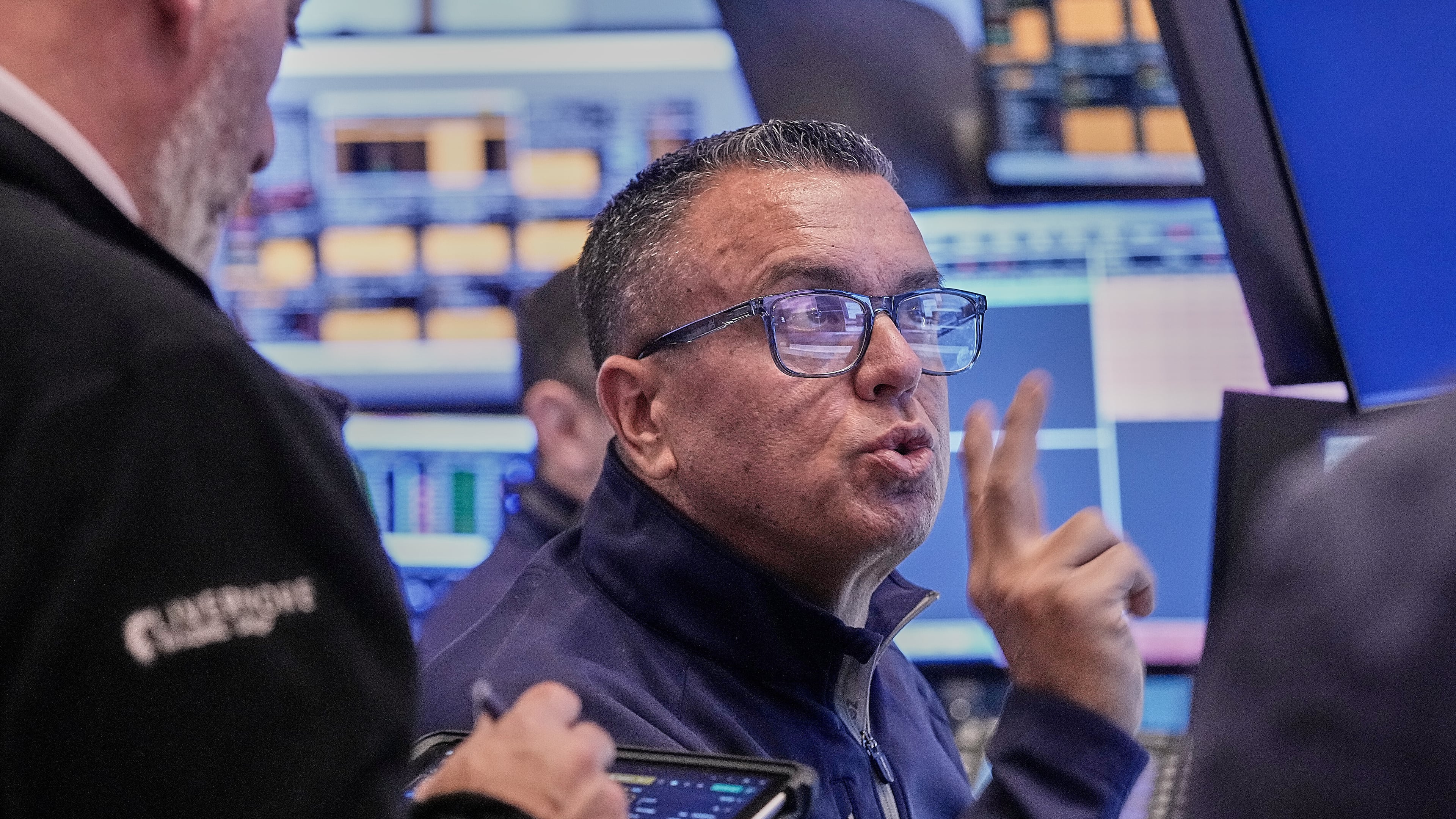 Trader Robert FInnerty Jr. works on the floor of the New York Stock Exchange, Thursday, Feb. 5, 2026. (AP Photo/Richard Drew)
