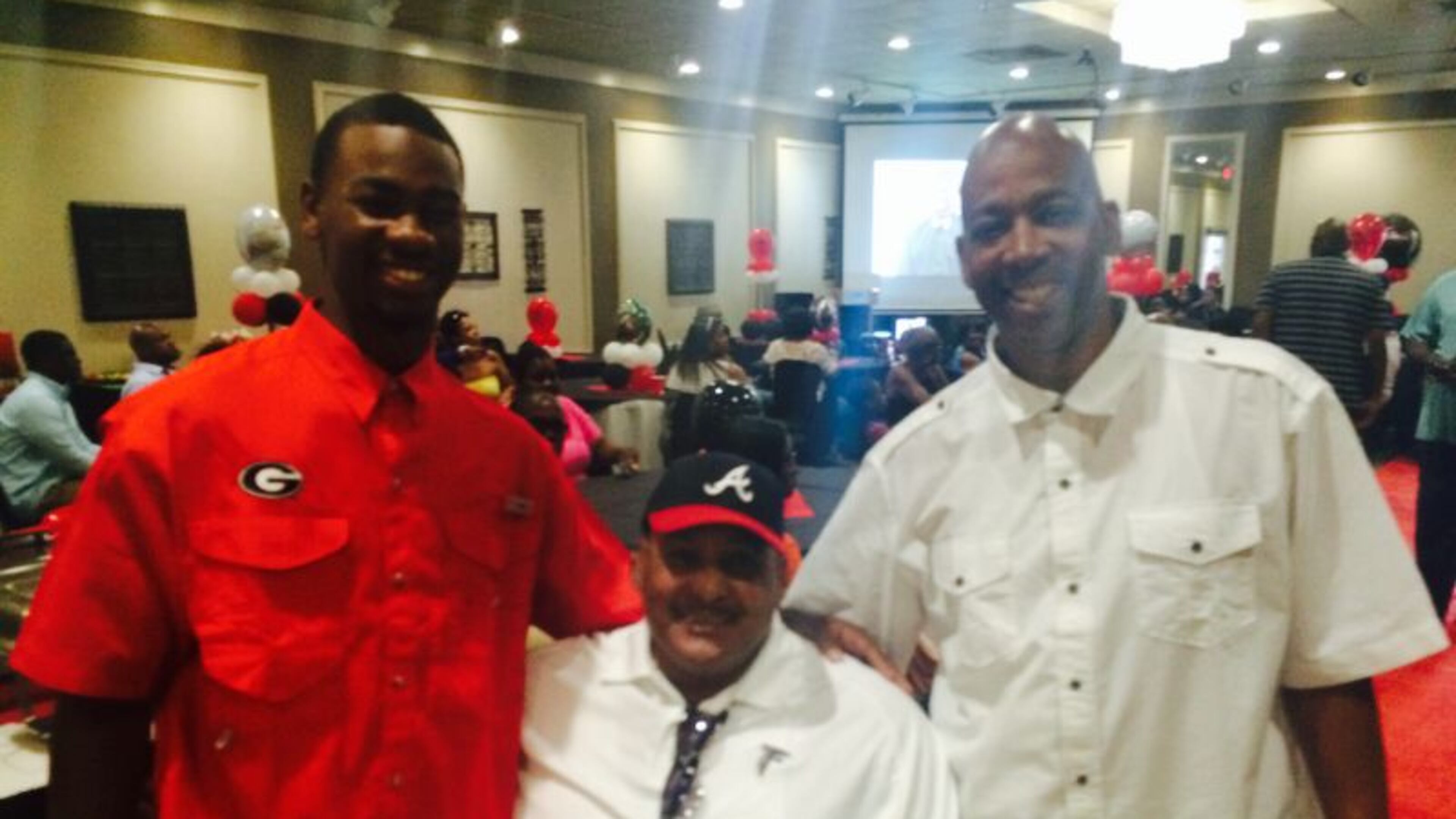 Three generations of baseball players from LaGrange include Terry Godwin II (left), Terry Godwin Sr. (right) and grandfather James Lewis Flowers. Godwin II will play football and baseball at UGA. (AJC photo)