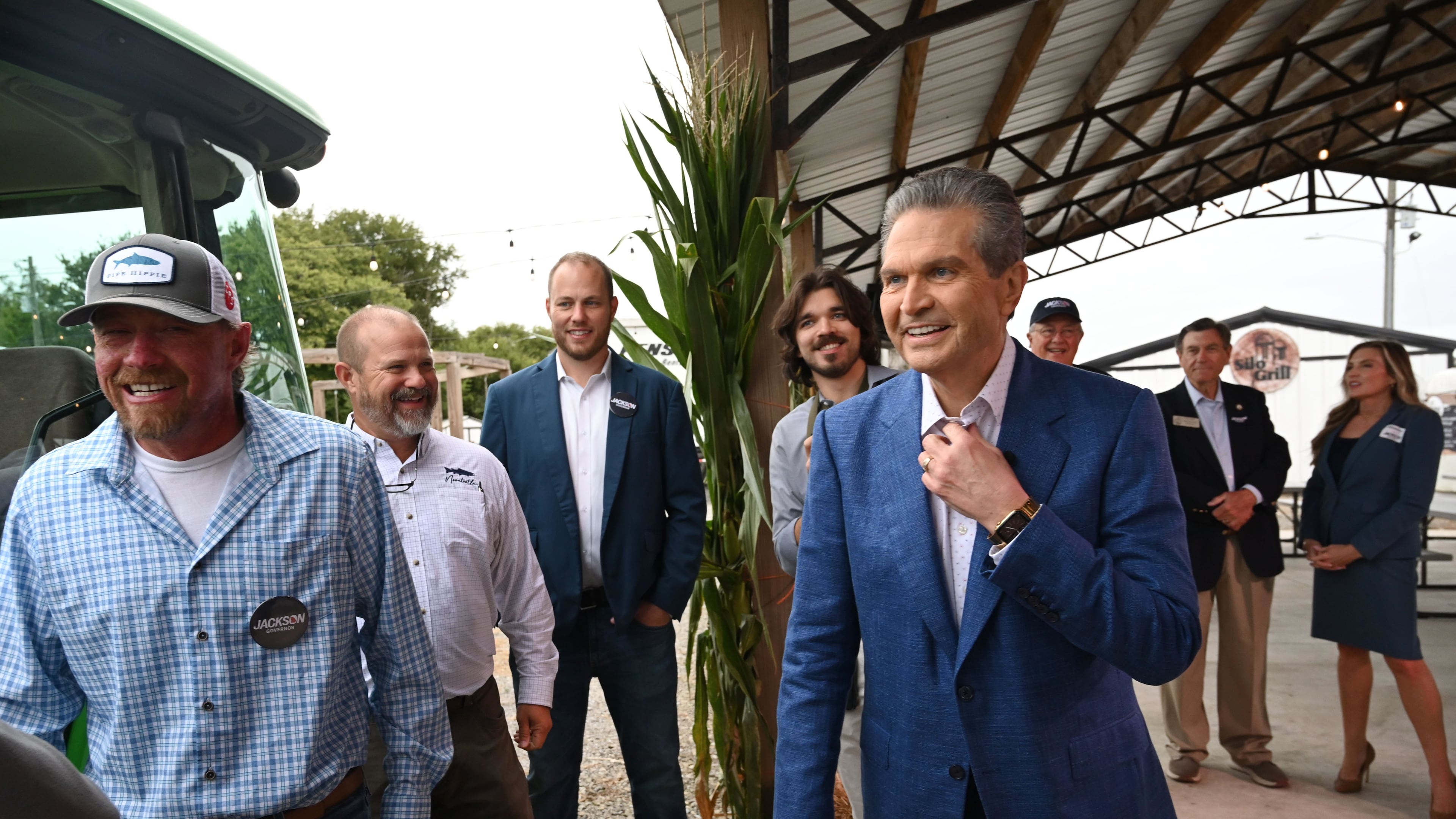 Georgia gubernatorial candidate Rick Jackson, right, reacts as he talks with local farmers and government officials supporting his campaign during an event announcing his plan to support Georgia farmers at Cagle's Family Farm on Thursday, Sept. 24, 2026, in Canton. (Hyosub Shin/AJC)