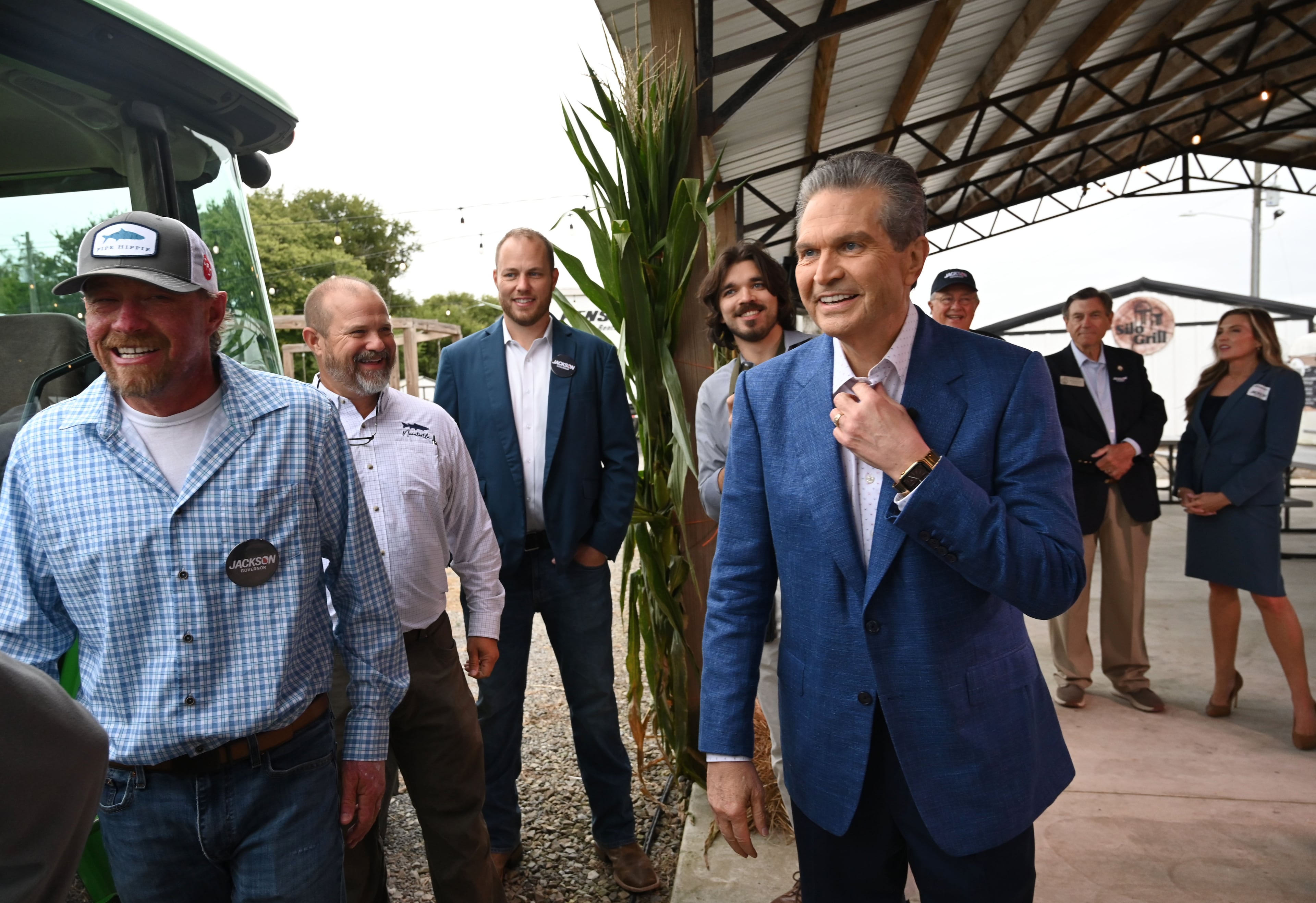 Republican nominee for governor Rick Jackson, right, reacts as he talks with local farmers and government officials supporting his campaign during an event announcing his plan to support Georgia farmers at Cagle's Family Farm in Canton last week. (Hyosub Shin/AJC)