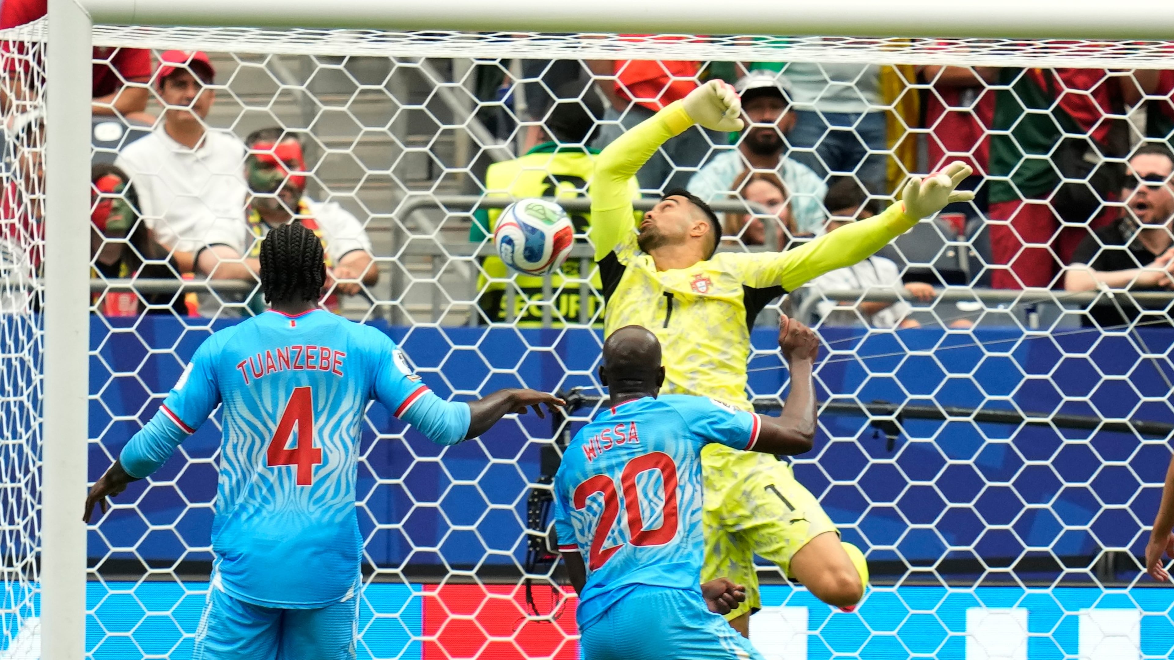 Congo's Yoane Wissa (20) scores his side's first goal against Portugal goalkeeper Diogo Costa during the World Cup Group K soccer match between Portugal and Congo in Houston, Wednesday, June 17, 2026. (AP Photo/Karen Warren)