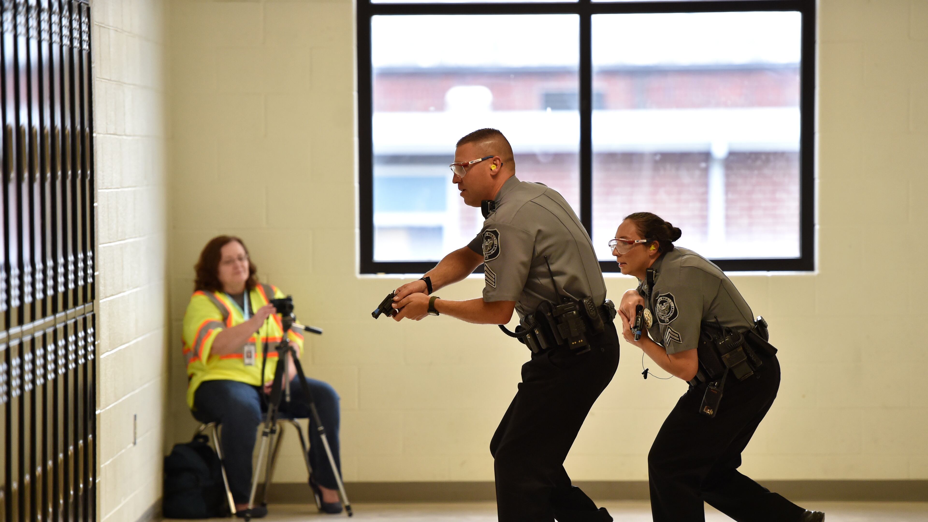 An active shooter drill performed by Villa Rica police officers at Villa Rica High School in October. Officials said drills are important tools to help reinforce disaster preparedness and give the faculty the skills they need to respond in a real-world scenario. BRANT SANDERLIN/BSANDERLIN@AJC.COM