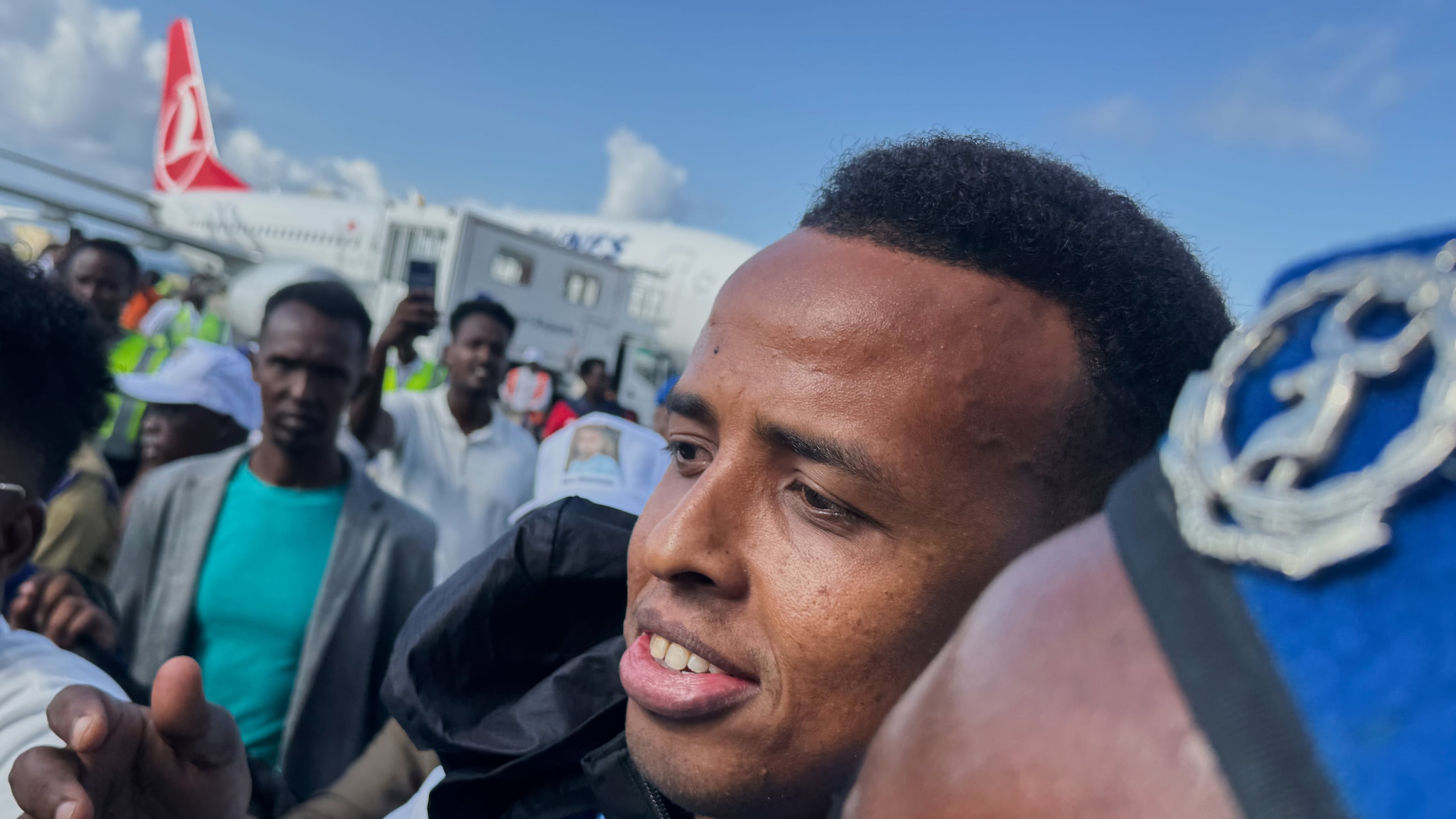 Referee Omar Artan, who was denied entry to the United States, is welcomed by supporters upon his arrival in Mogadishu, Somalia, Wednesday, June 10, 2026. (AP Photo/Farah Abdi Warsameh)